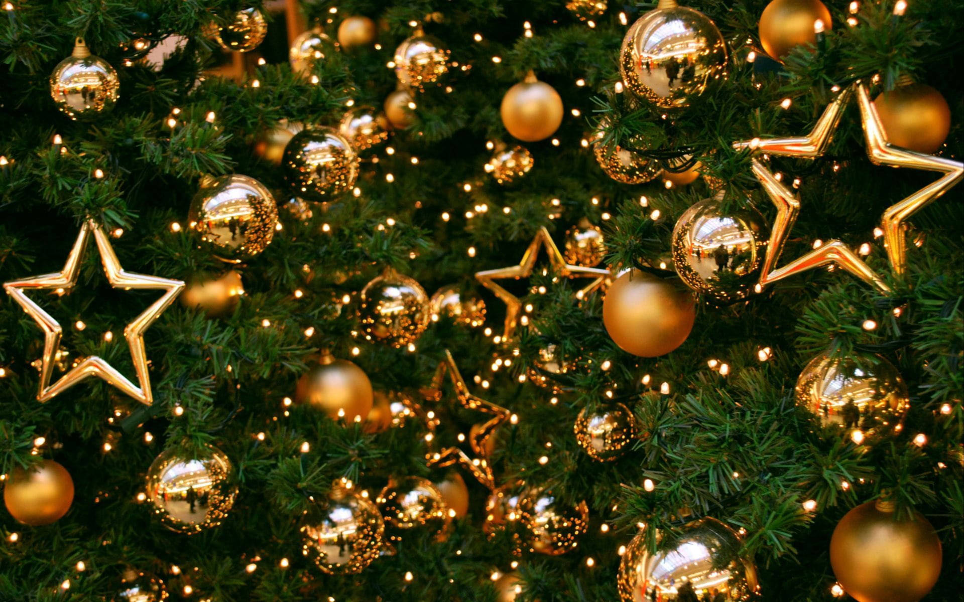 Gold Christmas Balls At Fir Tree Wallpaper
