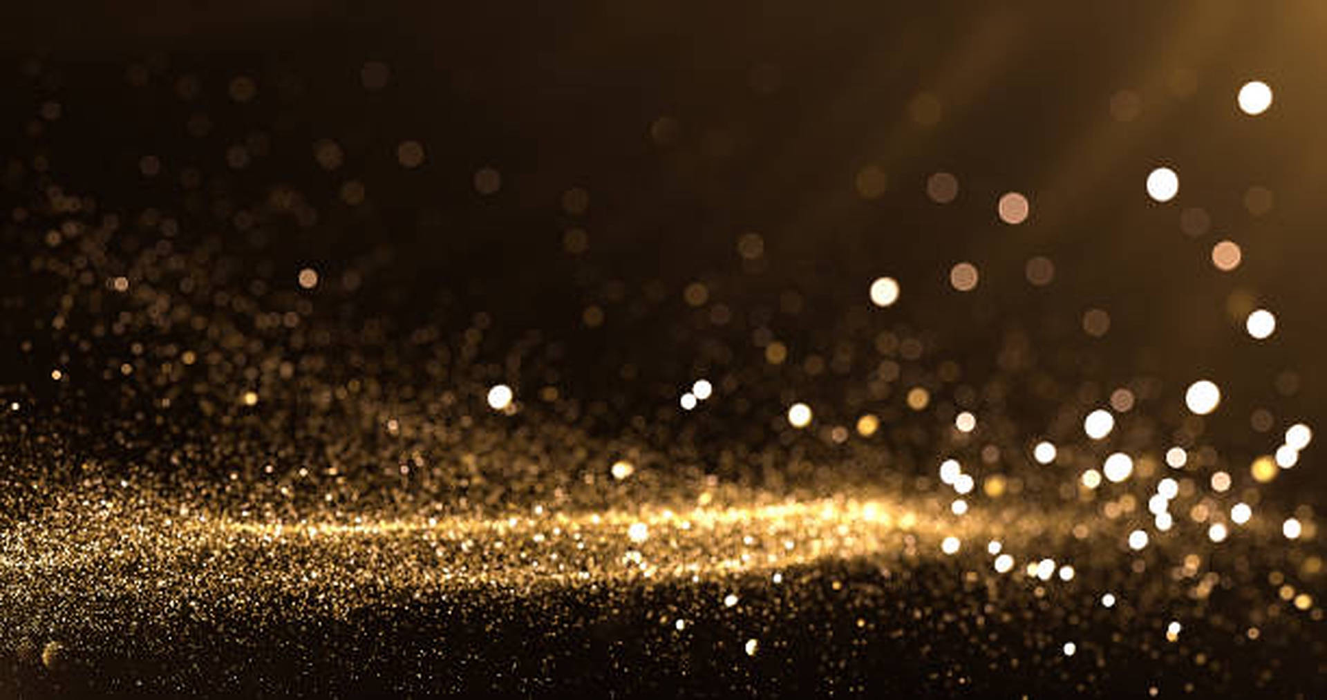 Nền hoàng kim óng ánh của tấm hình này khiến bạn như bước vào một không gian lấp lánh và rực rỡ. Hãy cùng chiêm ngưỡng những hạt vàng phát sáng với hình nền Gold Dust Shining Light Wallpaper.
