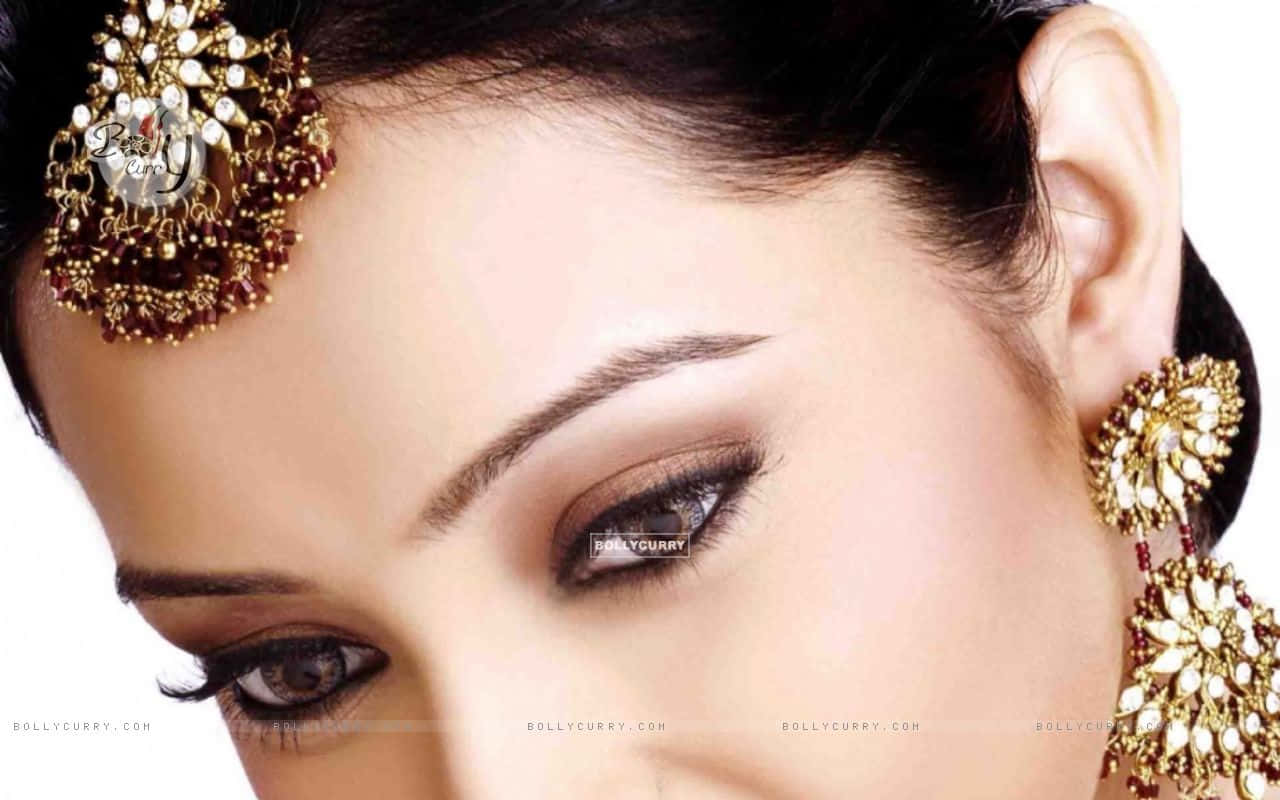 Enhance Your Glam Look With Gold Eyelash Wallpaper