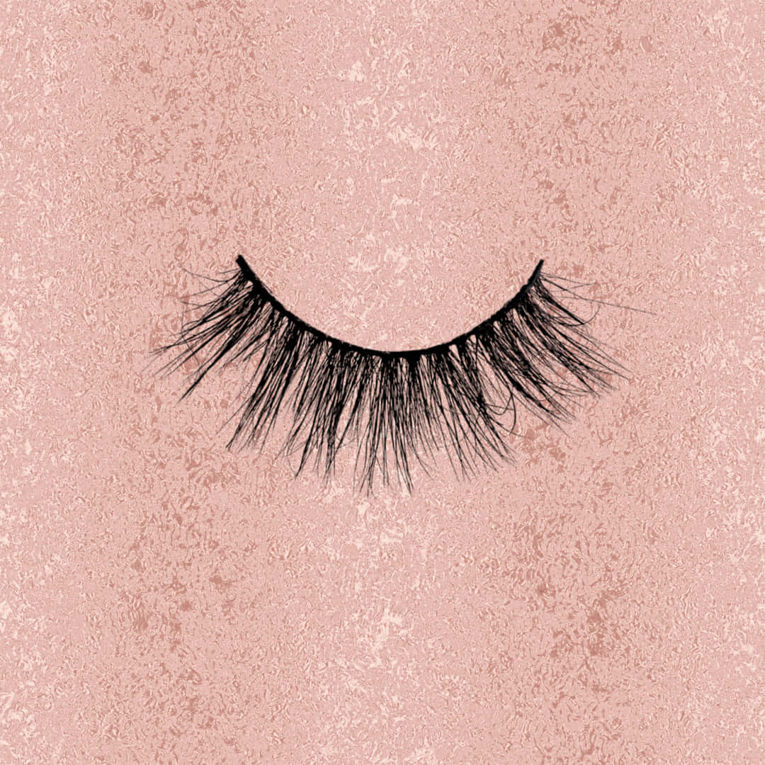 A Pair Of False Eyelashes On A Pink Background Wallpaper