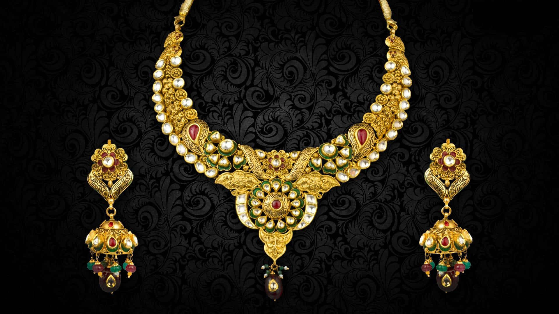 A Gold Necklace And Earrings Set With Stones