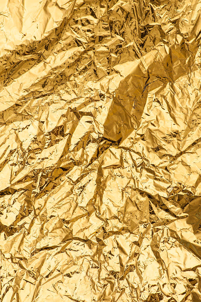 Crumpled Sheet Of Gold Metallic Background