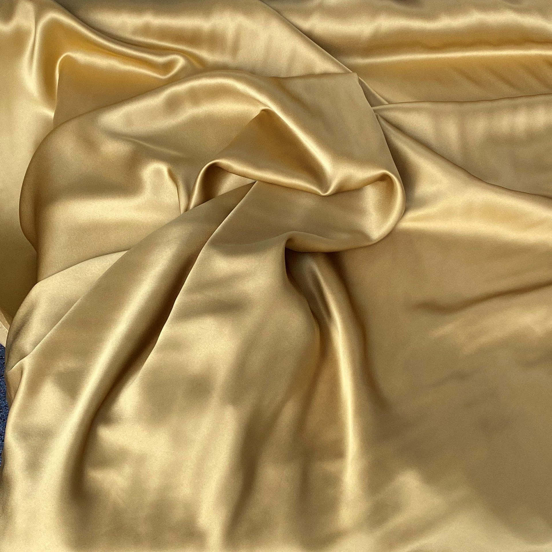 A beautiful warm-looking fabric in shades of gold and yellow. Wallpaper