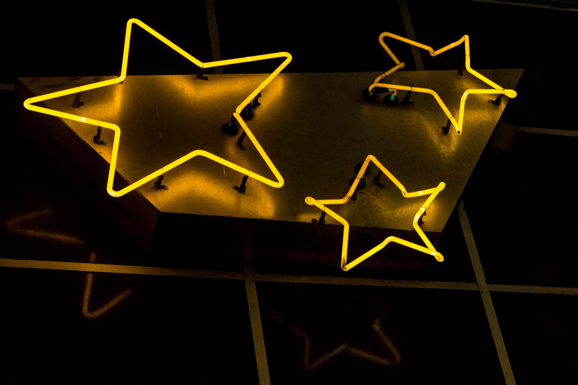 A Neon Sign With Stars