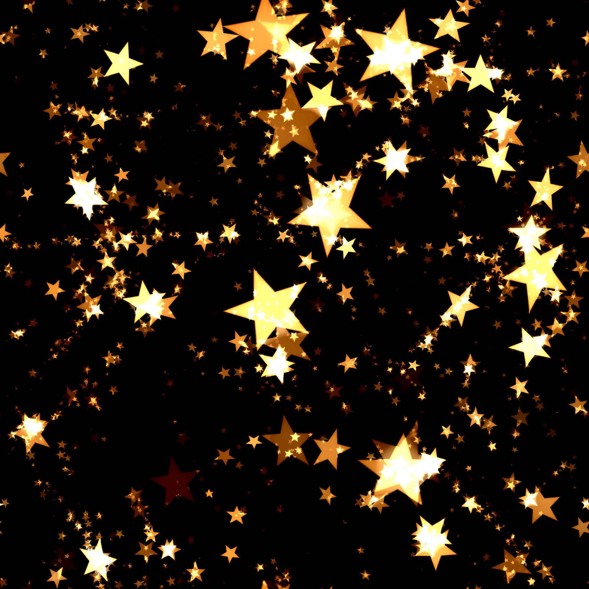 Gold Stars On A Black Background Wallpaper