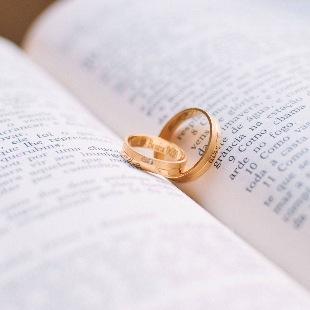 Gold Wedding Rings On Book