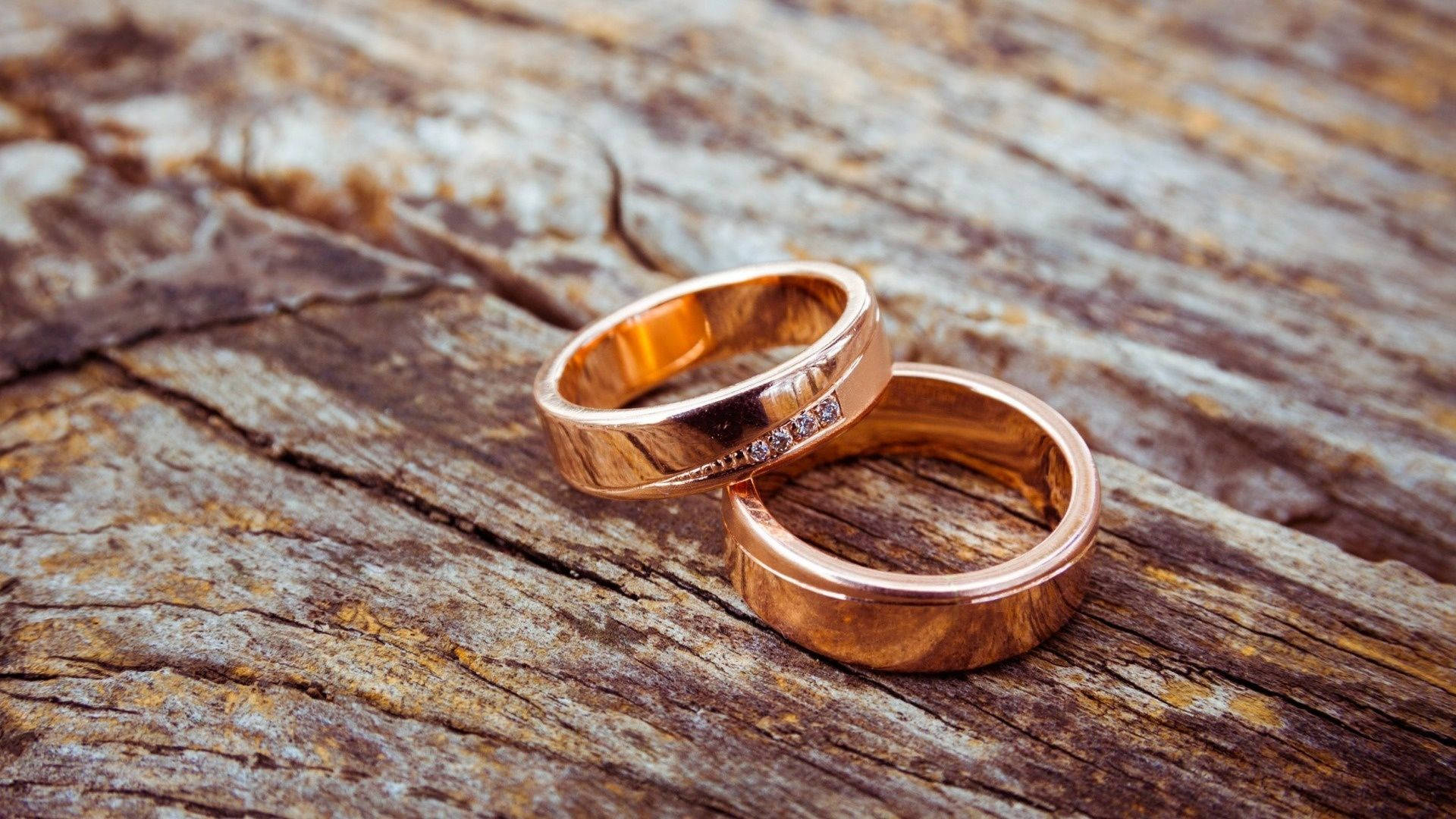 Gold Wedding Rings On Wood