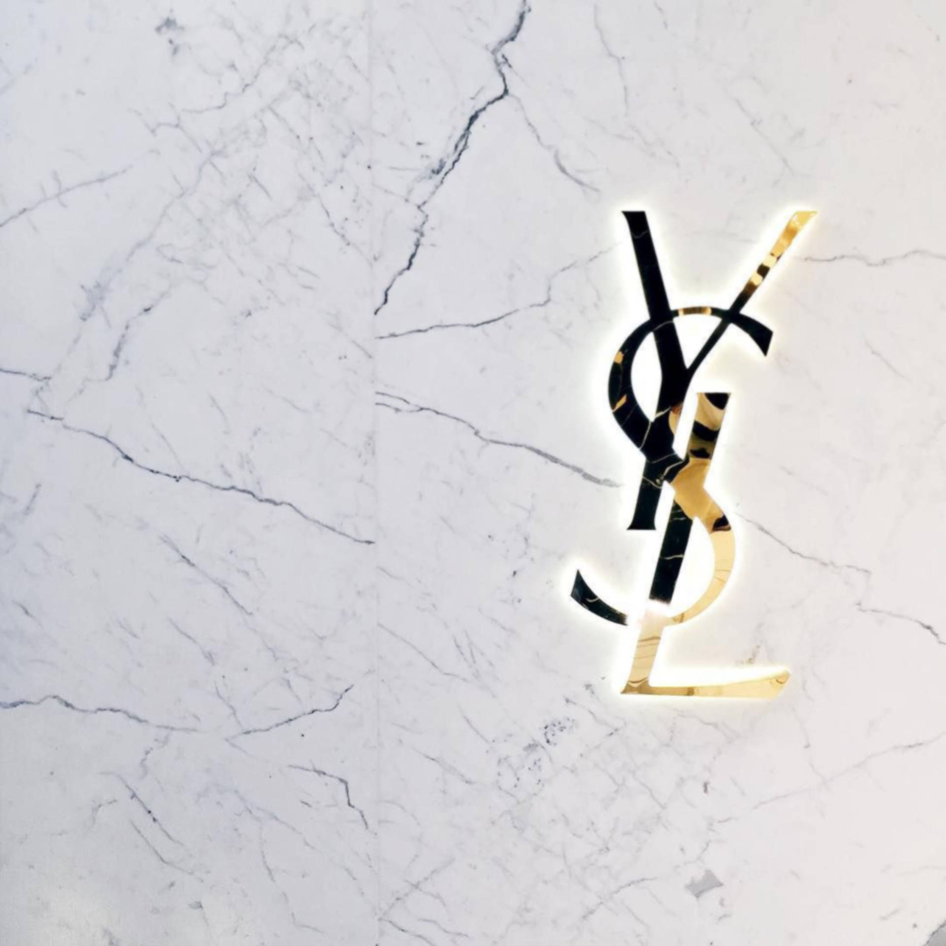 Download Gold YSL At Marble Wallpaper | Wallpapers.com