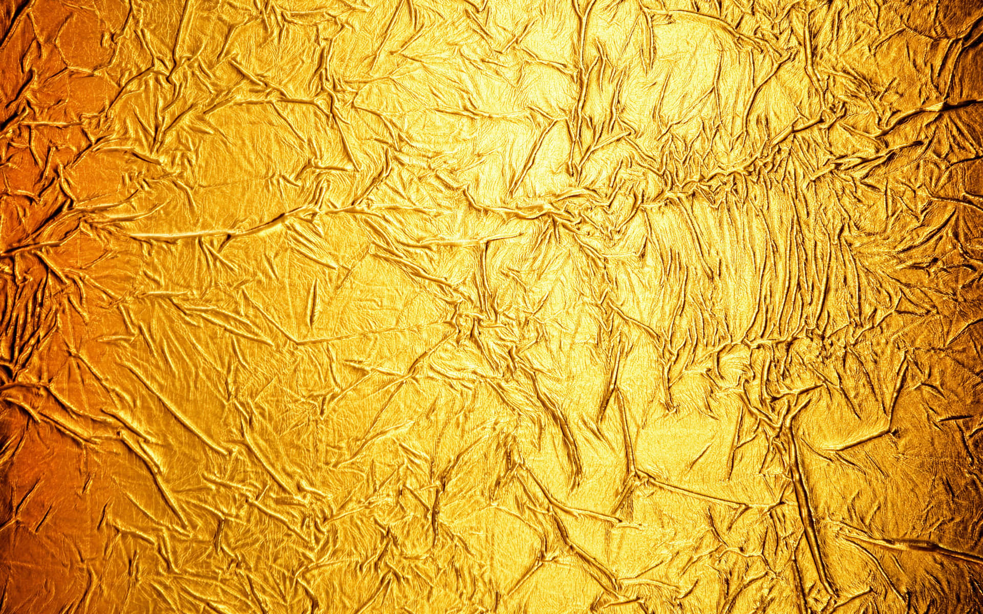 Crumpled Golden Foil Texture Background