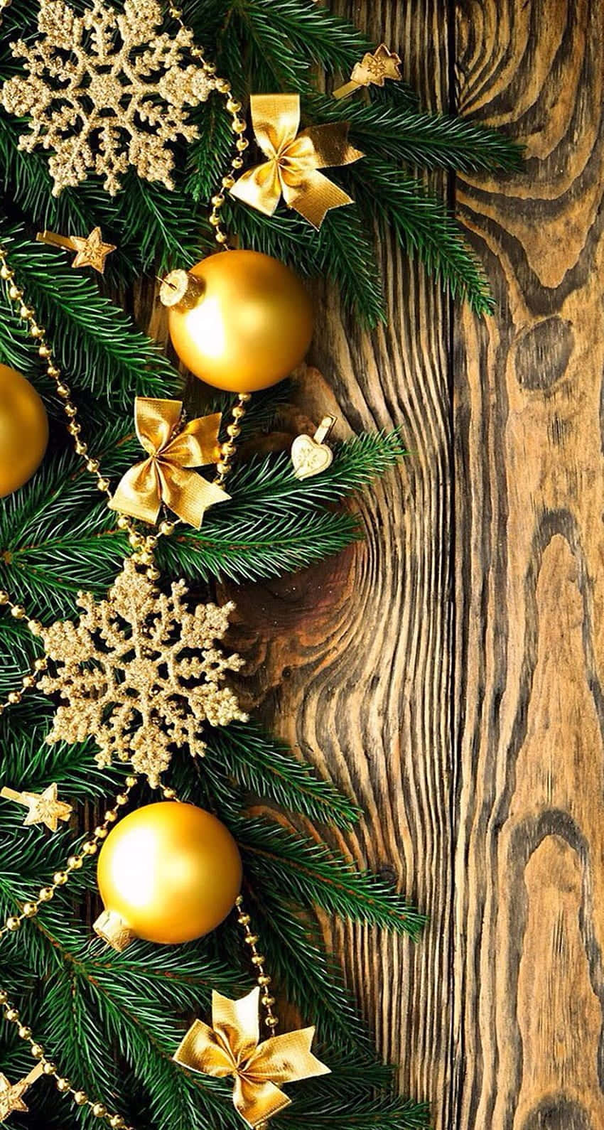 Golden Christmas Decorationson Wooden Background Wallpaper