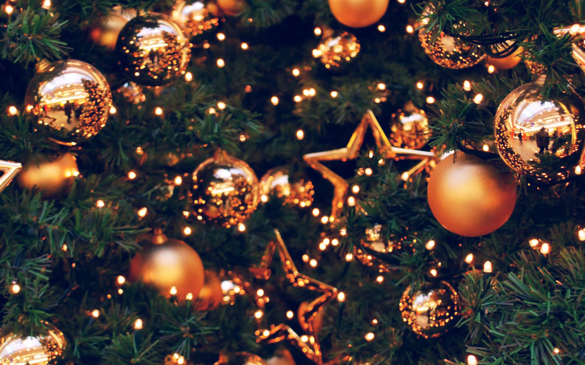 Golden Christmas Ornamentsand Lights Wallpaper