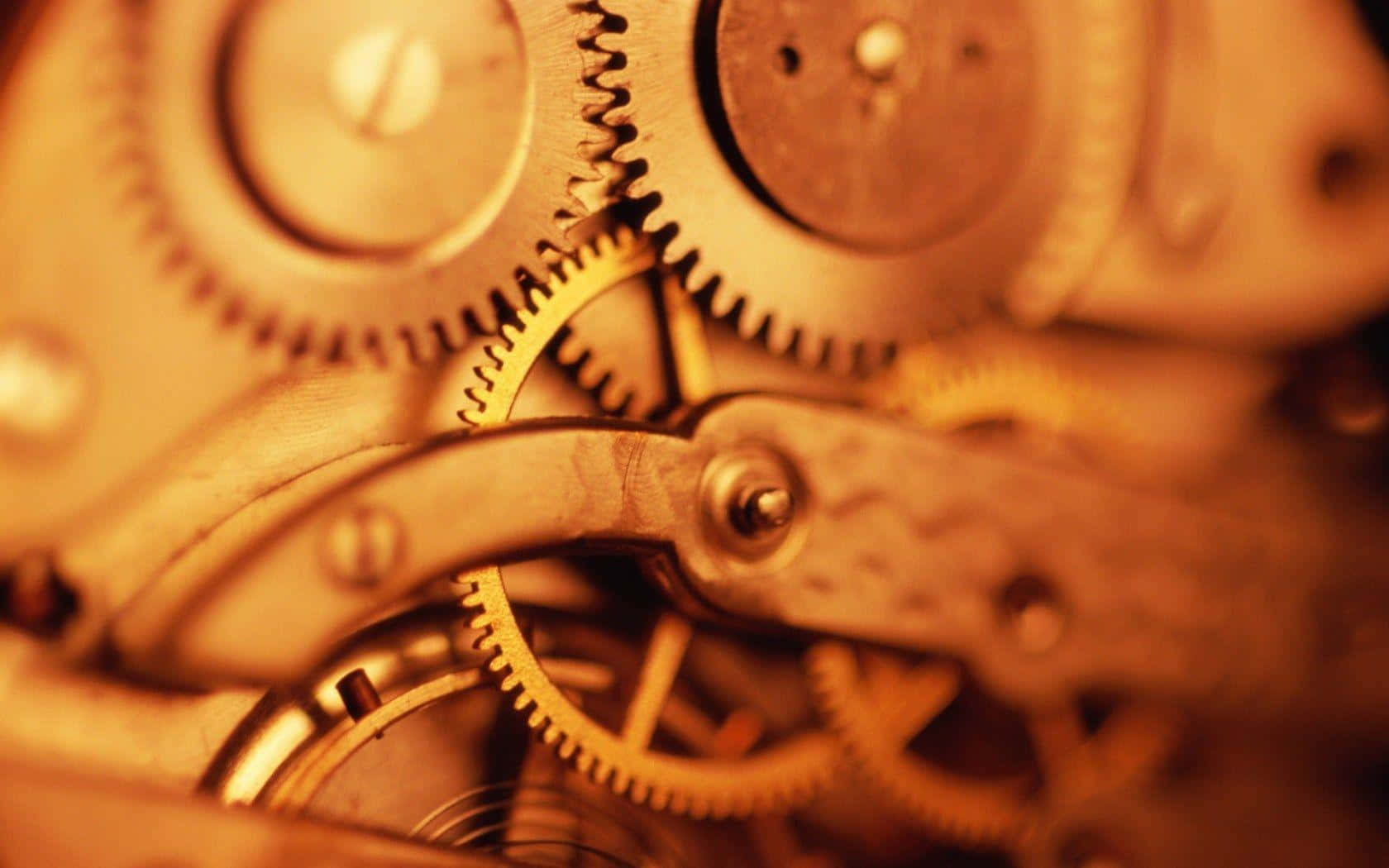 Golden Mechanical Gears Closeup.jpg Wallpaper