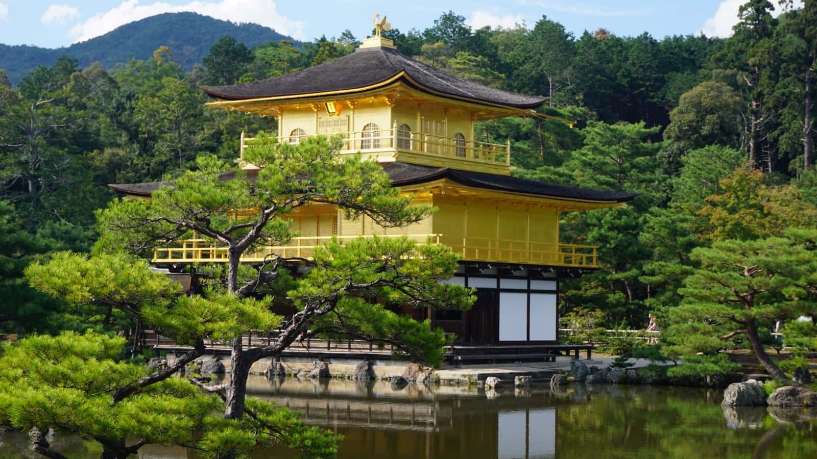 Golden Pavilion Amidst Serene Landscape Wallpaper