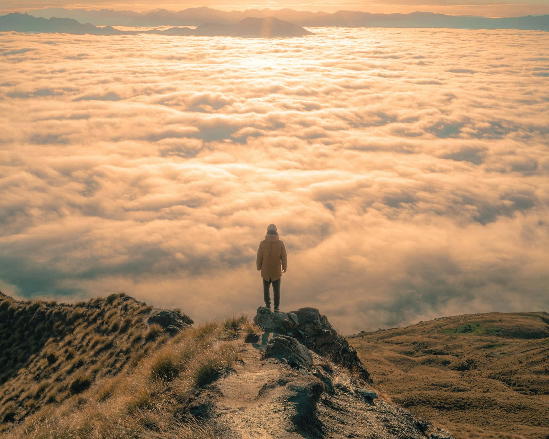 Golden Sunrise Over Clouds Wallpaper