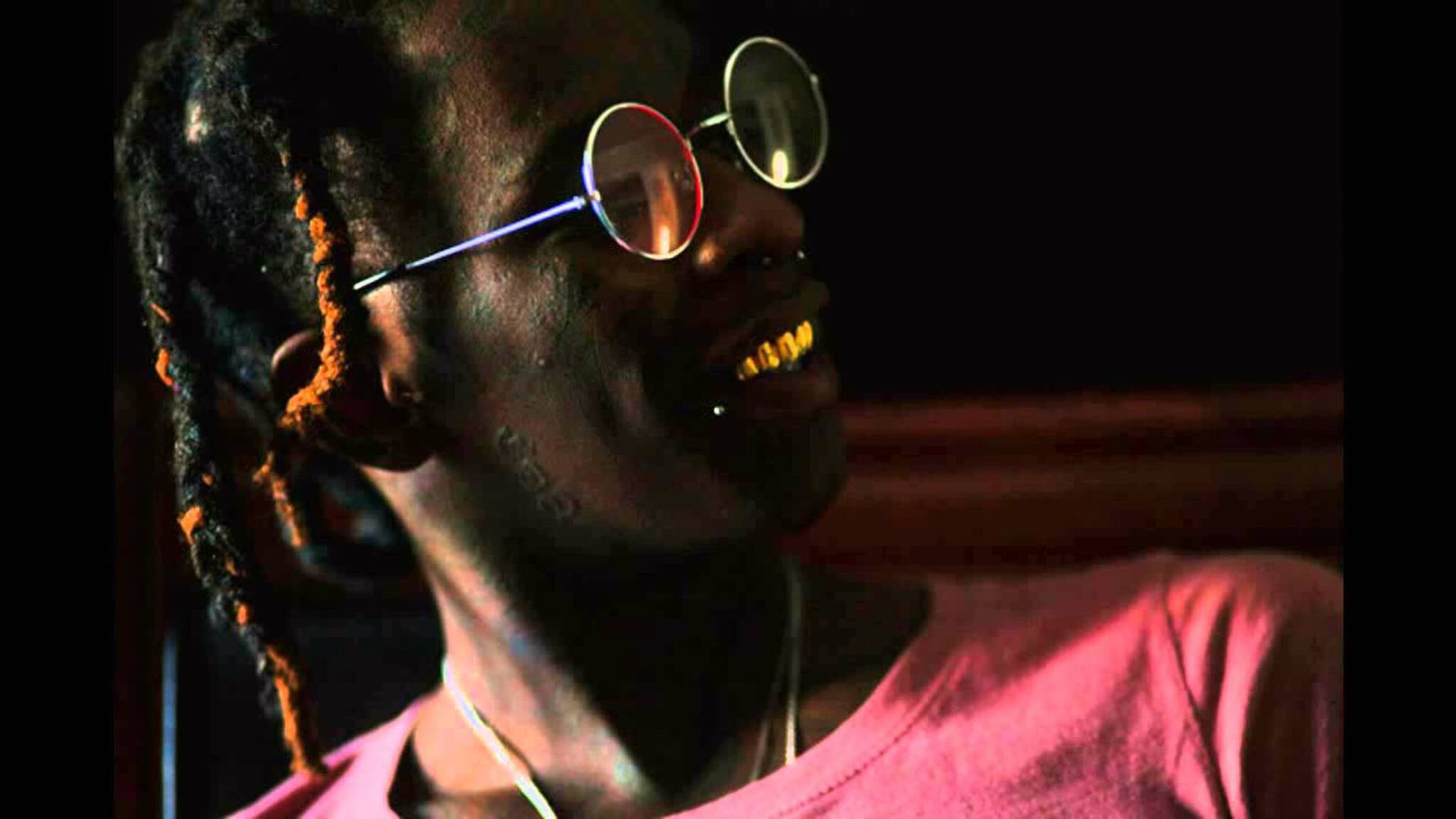 Young Thug flaunting his golden teeth Wallpaper