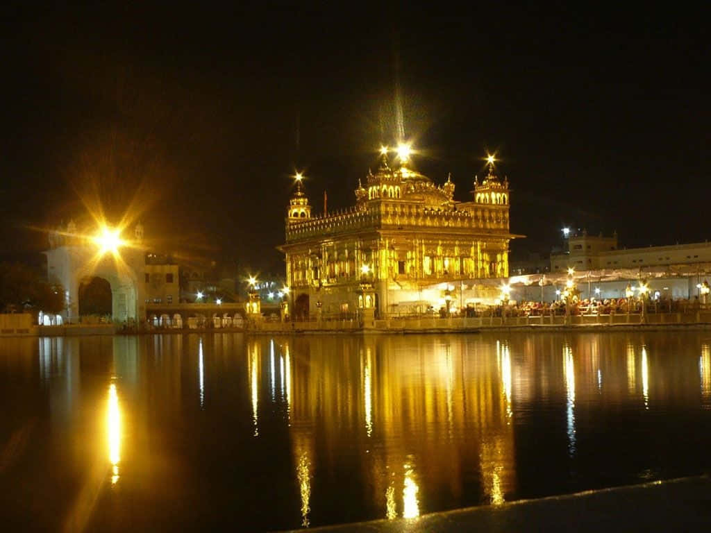 Caption: Serene view of the Golden Temple with its reflection on the calm water