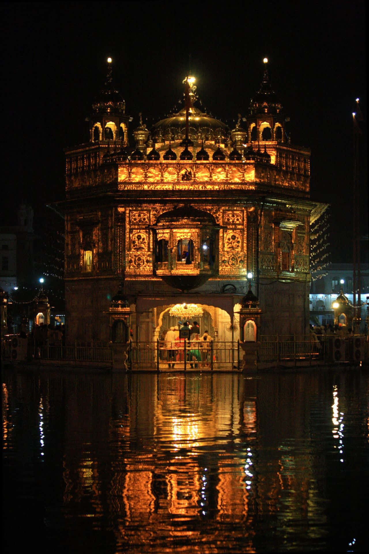 Serene View of the Glowing Golden Temple at Dusk