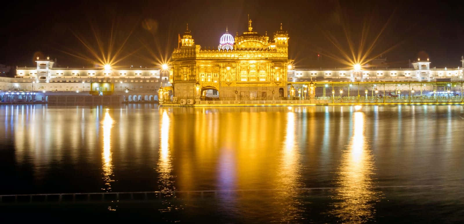 Majestic view of the illuminated Golden Temple in Amritsar, India at night