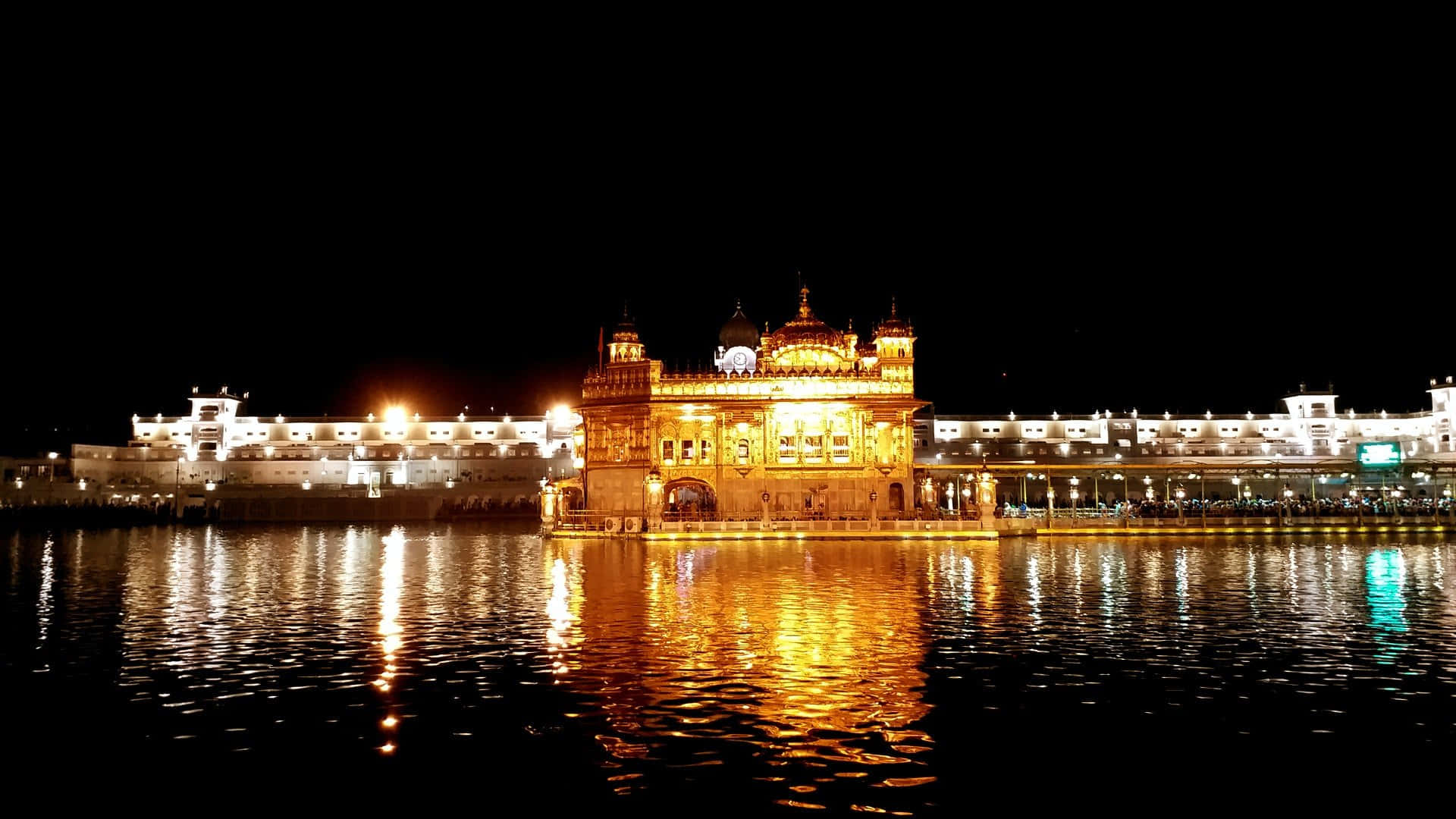 Serene view of the majestic Golden Temple reflecting on the calm waters