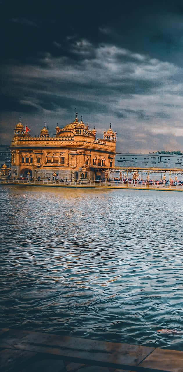 Download Golden Temple On A Stormy Day Wallpaper 