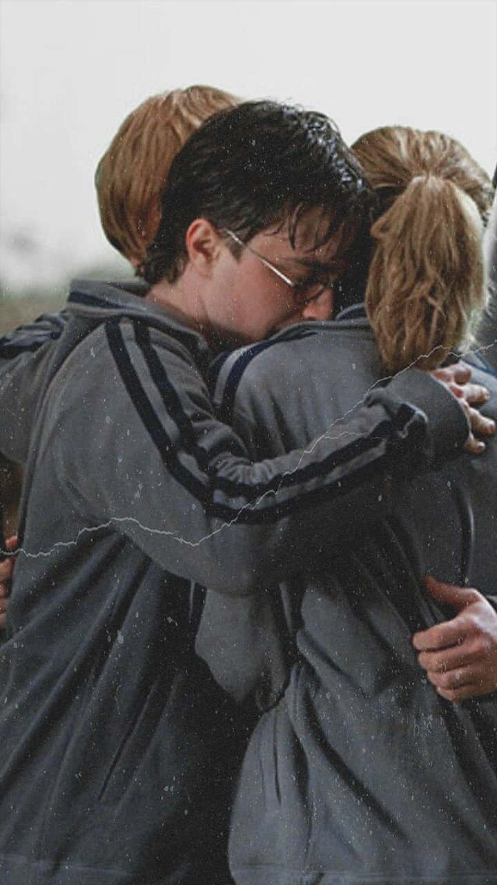 Harrypotter, Hermione Granger Och Ron Weasley - Den Legendariska Gyllene Triaden. Wallpaper