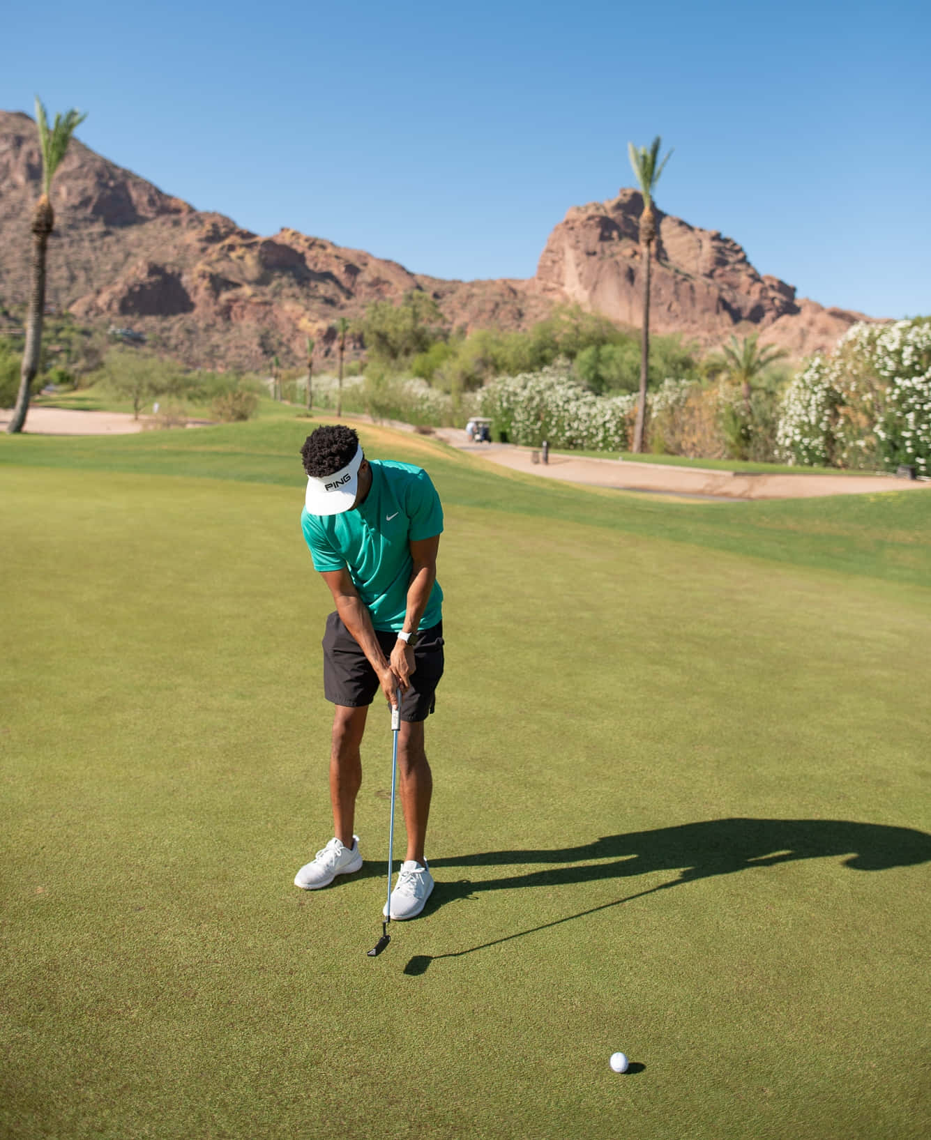 Caption: A Serene Golf Course at Sunset Wallpaper