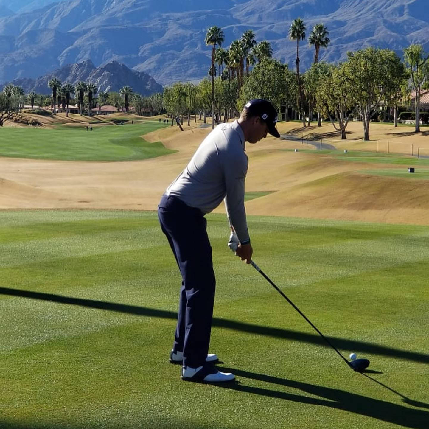 Golfer Preparingfor Driveon Sunny Course Wallpaper