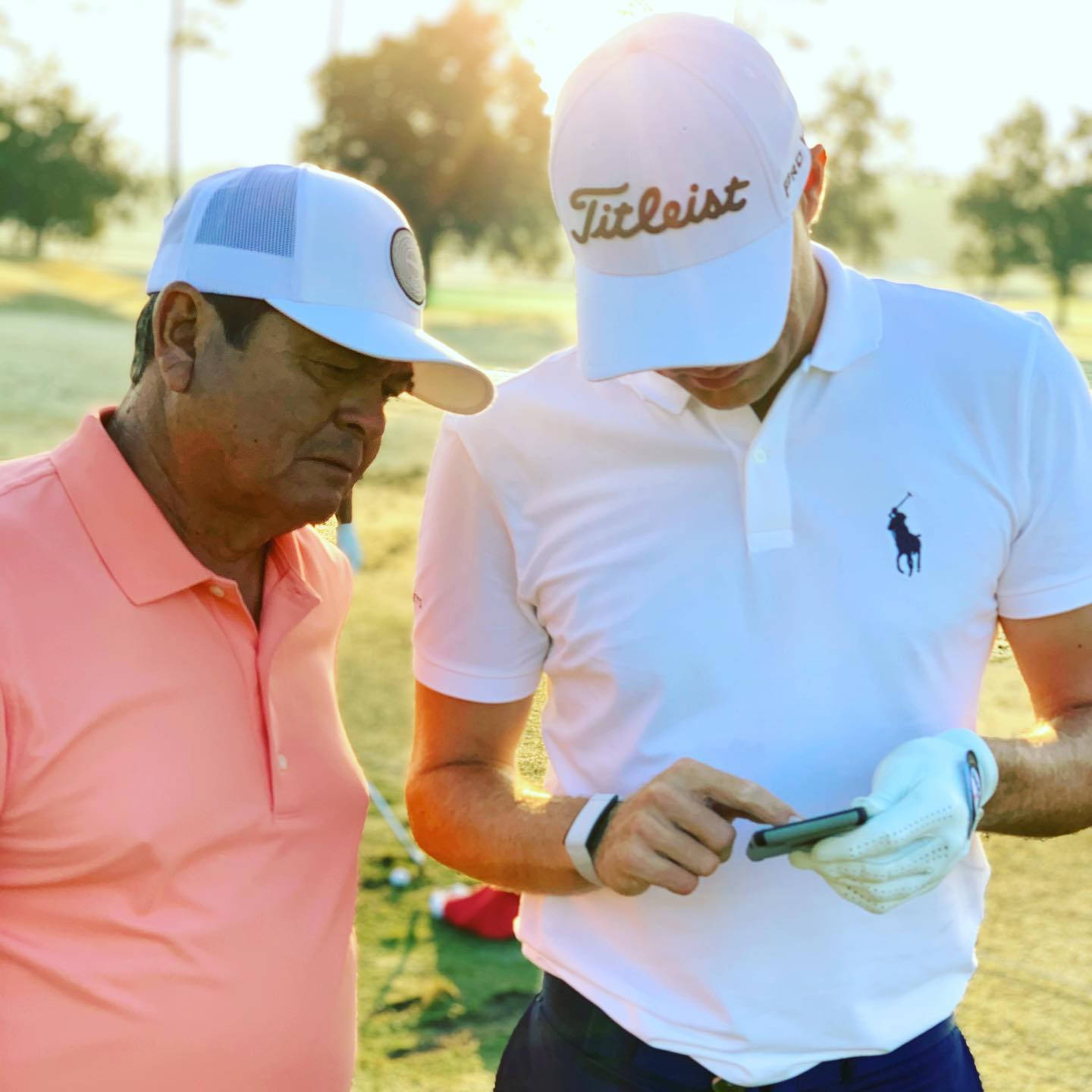 Golfers Reviewing Scoreon Phone Wallpaper