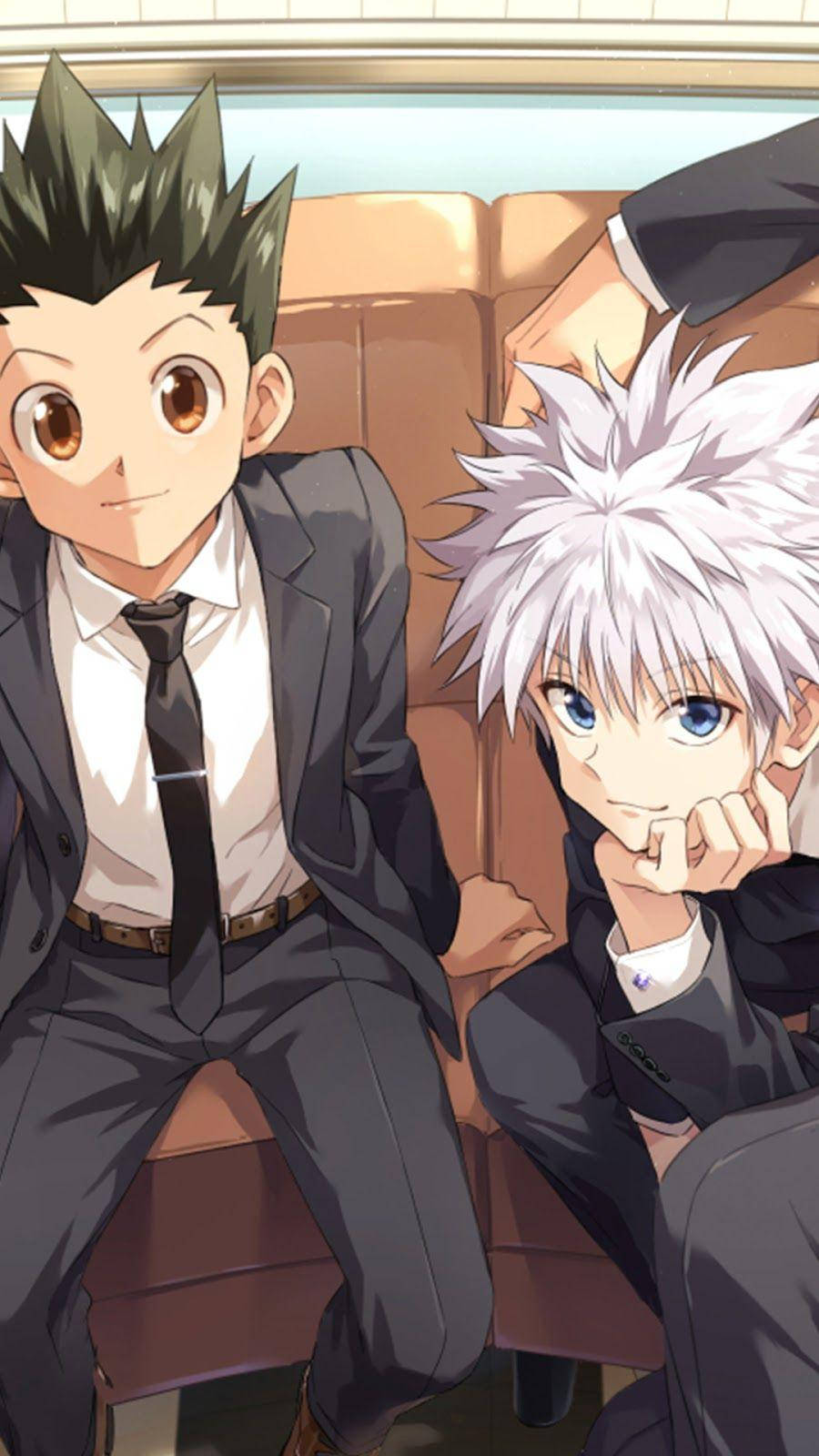 Gon And Killua Sitting In Suits Wallpaper