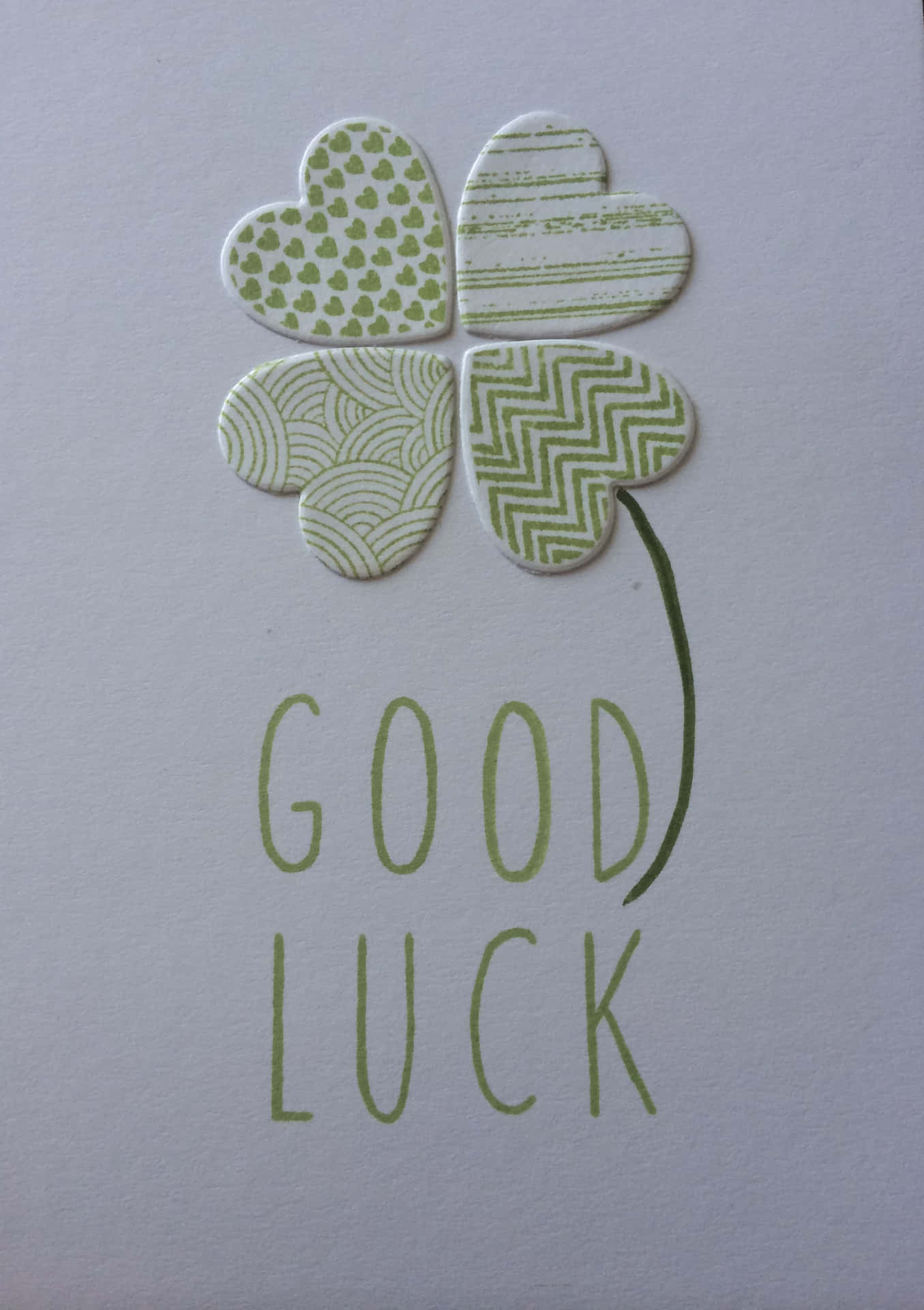 A Card With A Clover And The Words Good Luck