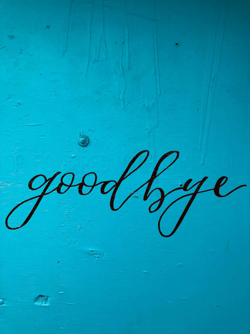 A Blue Wall With The Word Goodbye Written On It