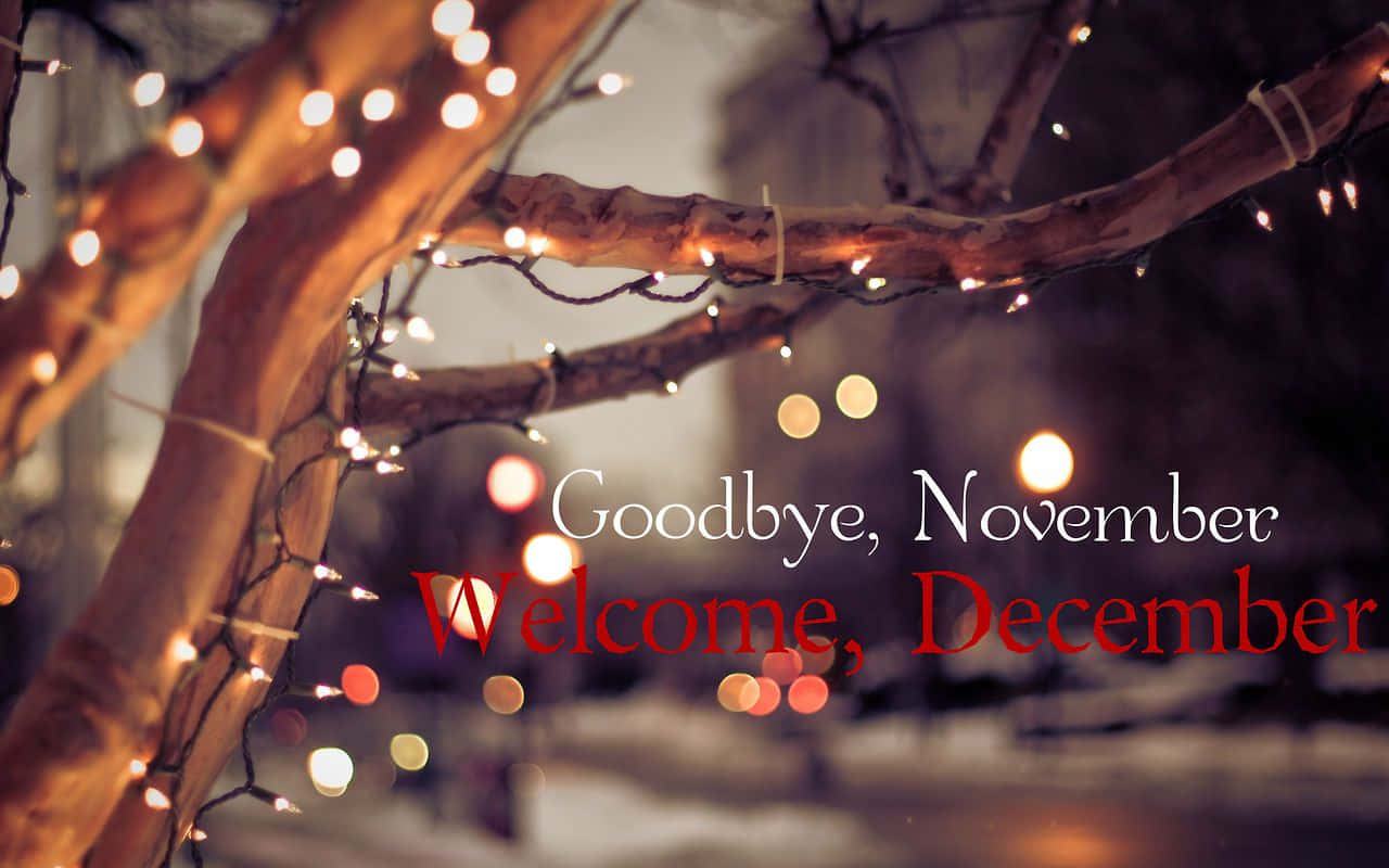 Et træ med lys og ordene farvel november velkommen december Wallpaper