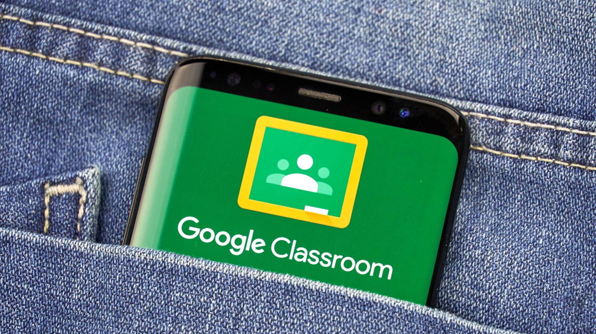 Aplicaciónde Google Classroom En El Teléfono En El Bolsillo. Fondo de pantalla