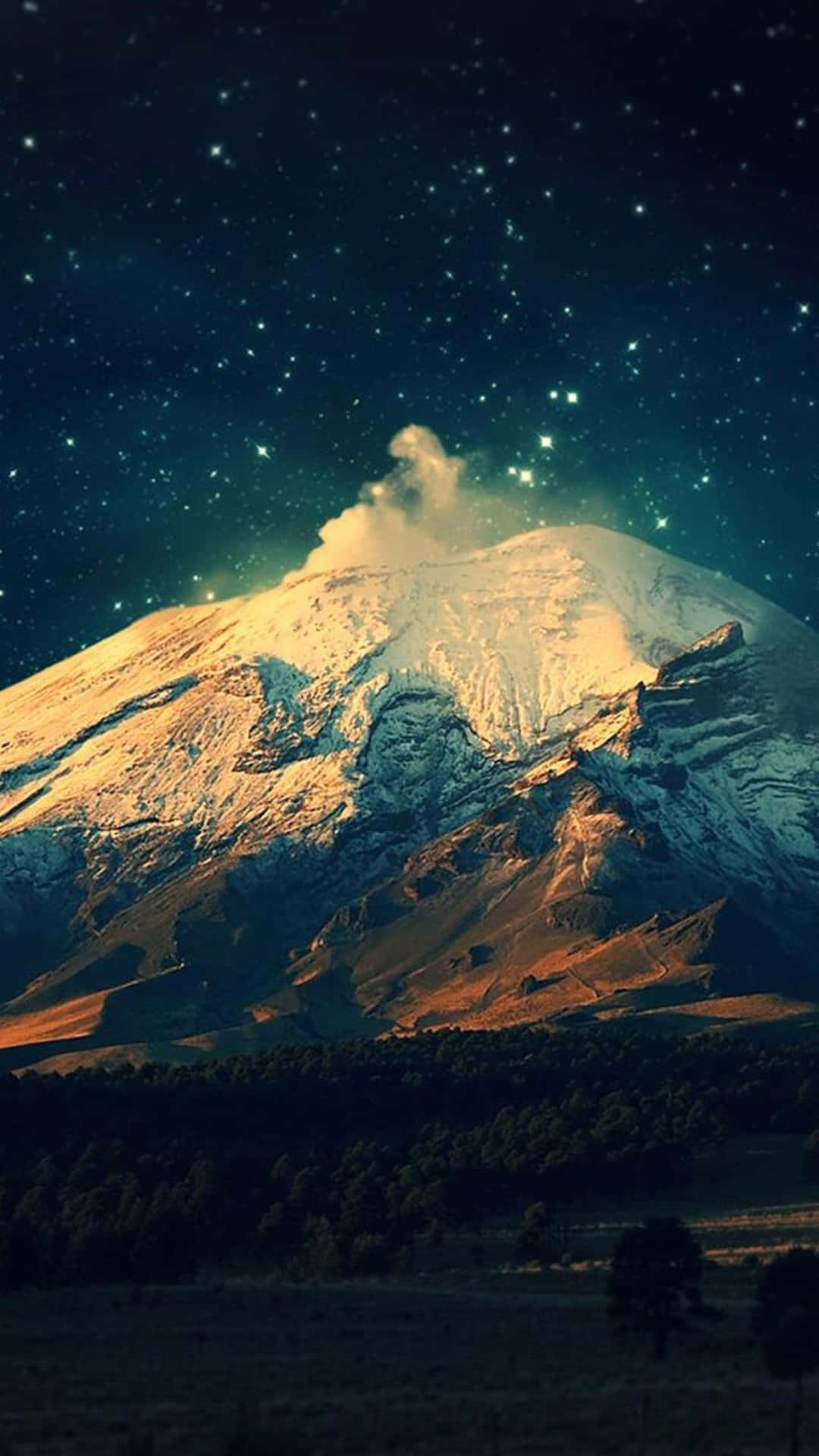 A Mountain Covered In Snow Under The Stars Wallpaper
