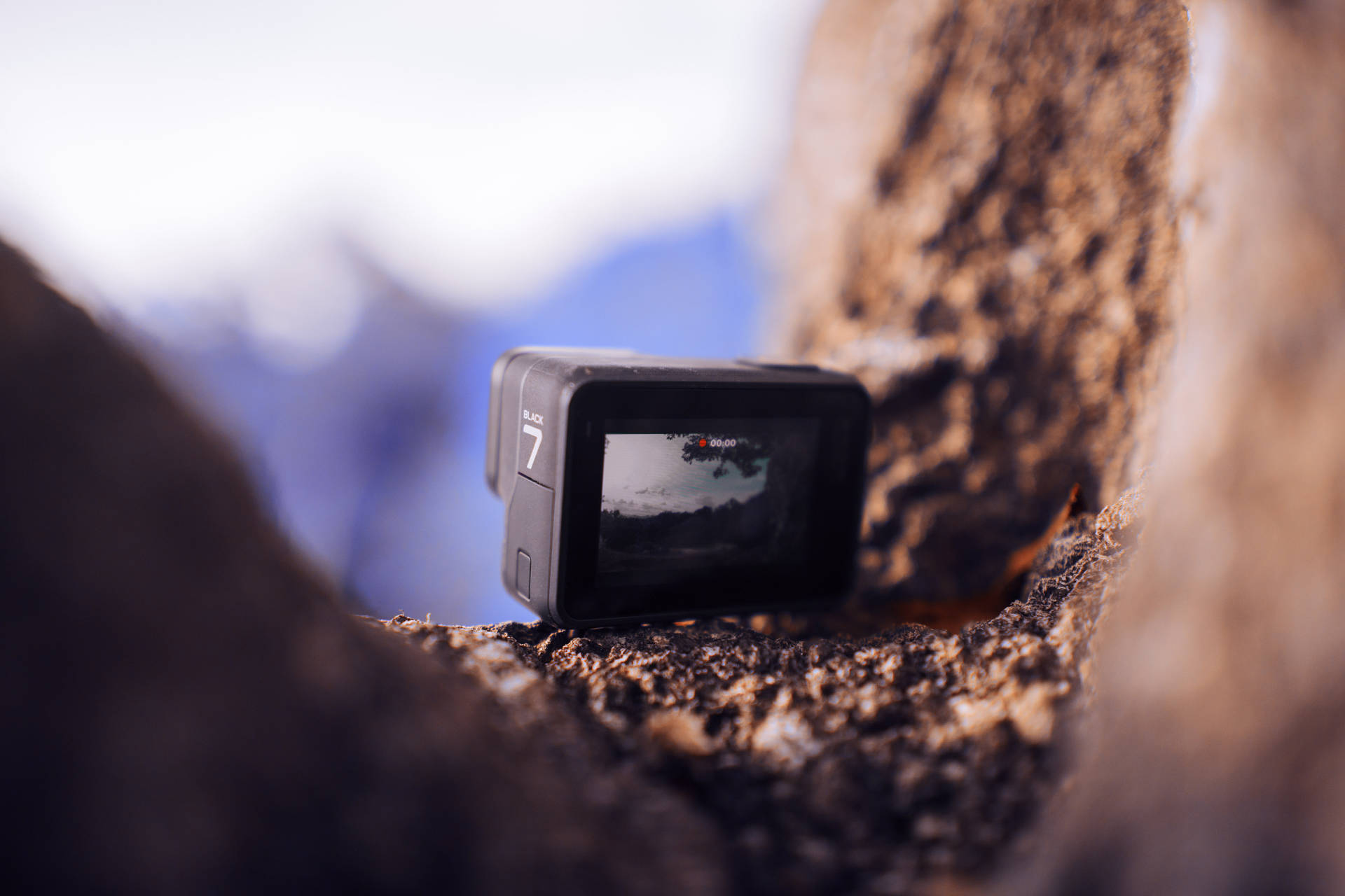 Gopro On A Rocky Edge Background