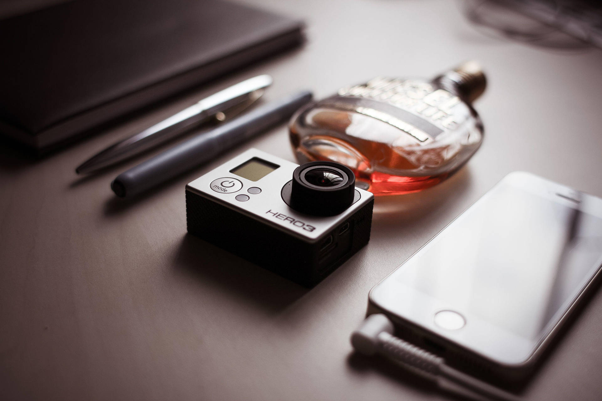 Gopro With A Perfume Bottle Background