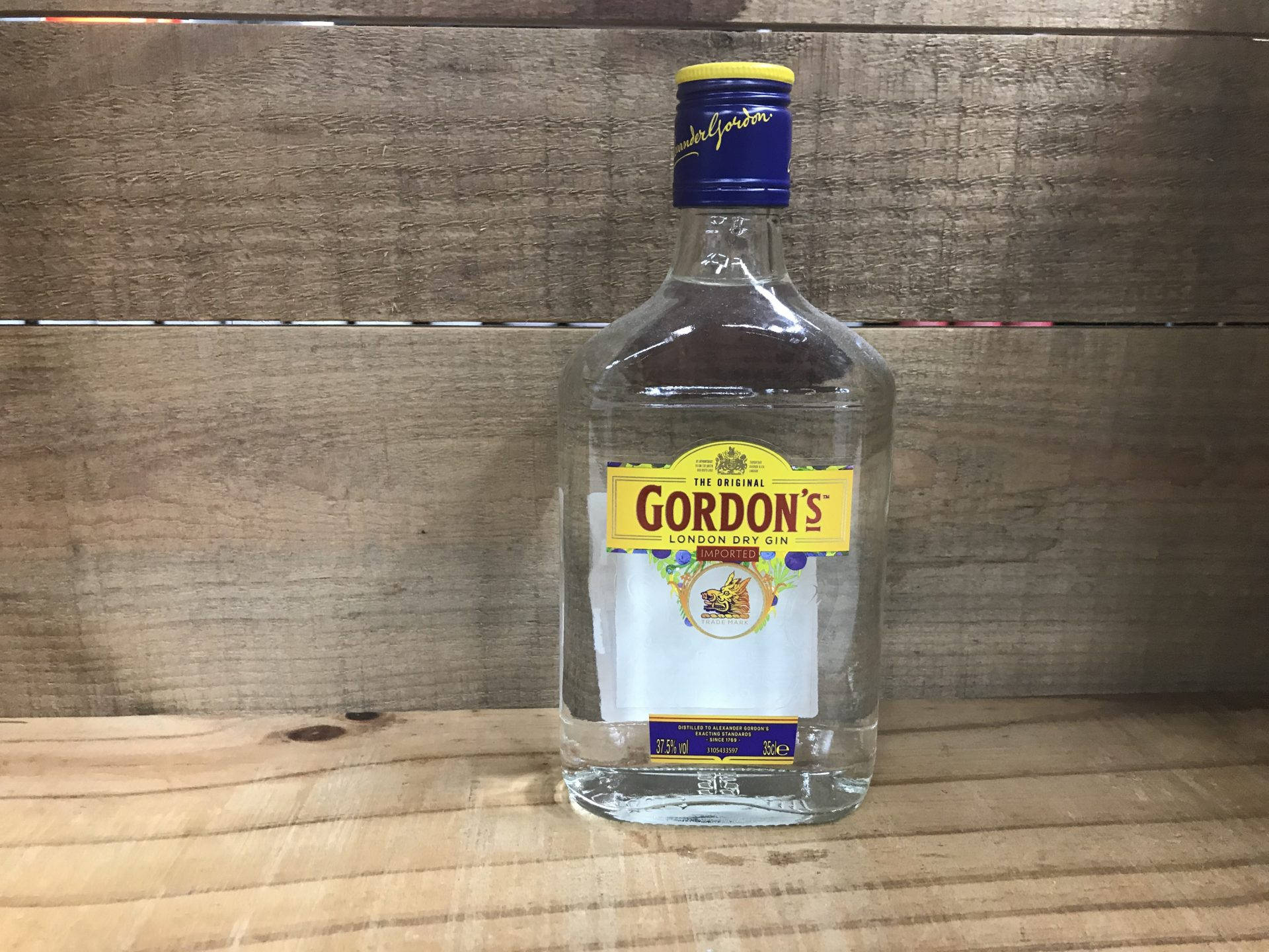 Gordon's Dry Gin Bottle Gray Wall Wallpaper