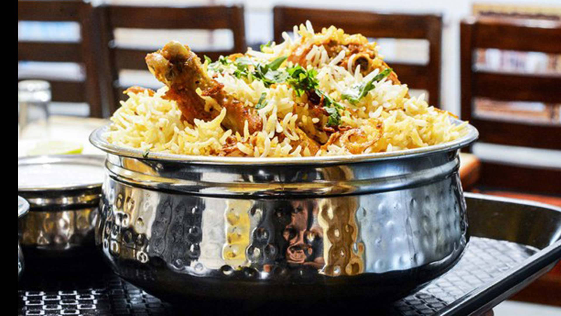 Sumptuous Biryani Served in a Silver Bowl Wallpaper