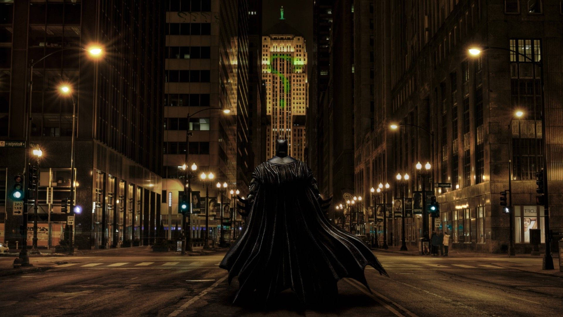 Mysterious Green Question Mark Illuminating Over Gotham City Wallpaper