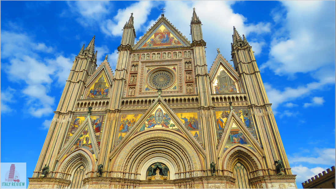 Majestic gothic architecture of a medieval church with intricate detailing Wallpaper