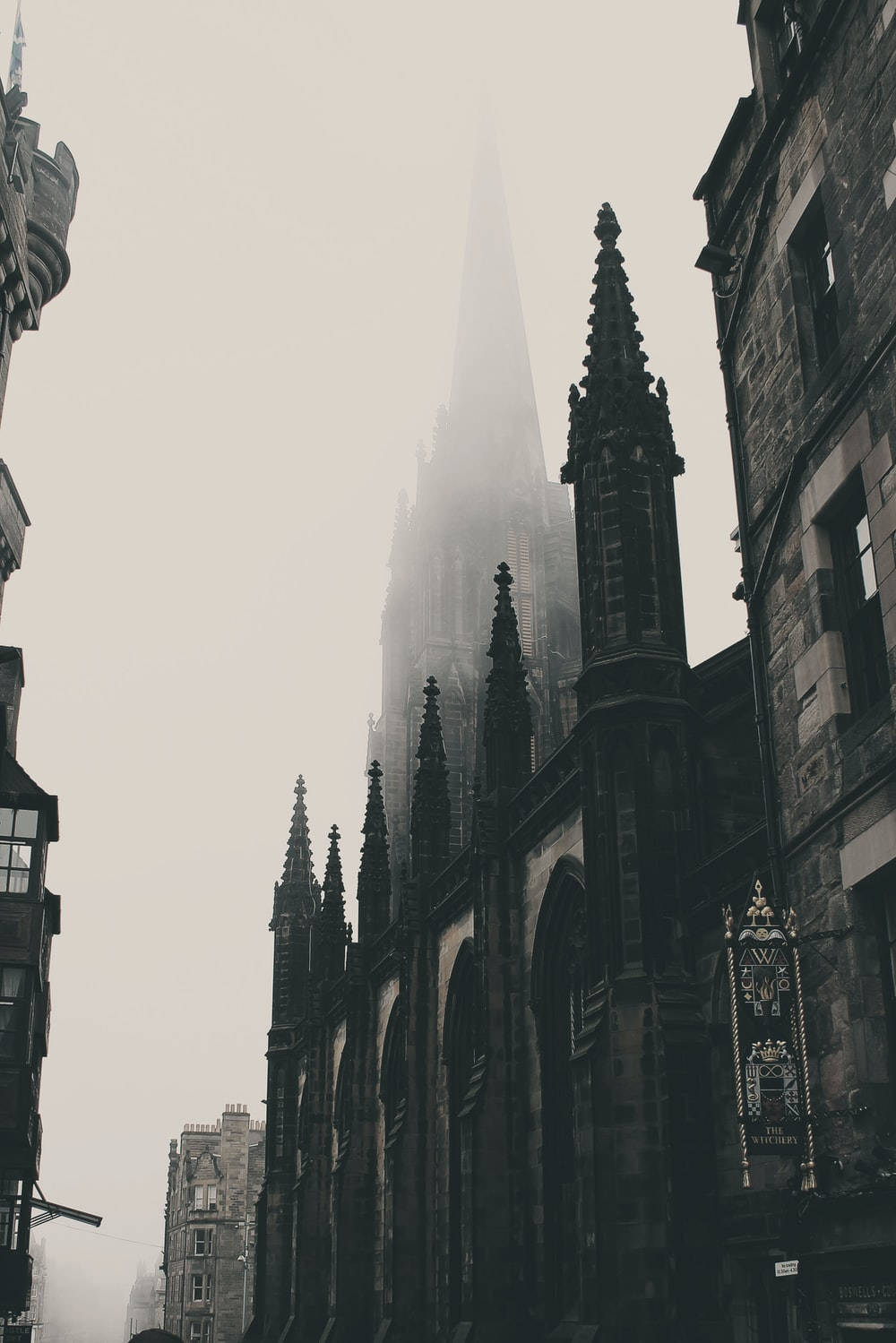 A Foggy Street With A Church In The Background Wallpaper