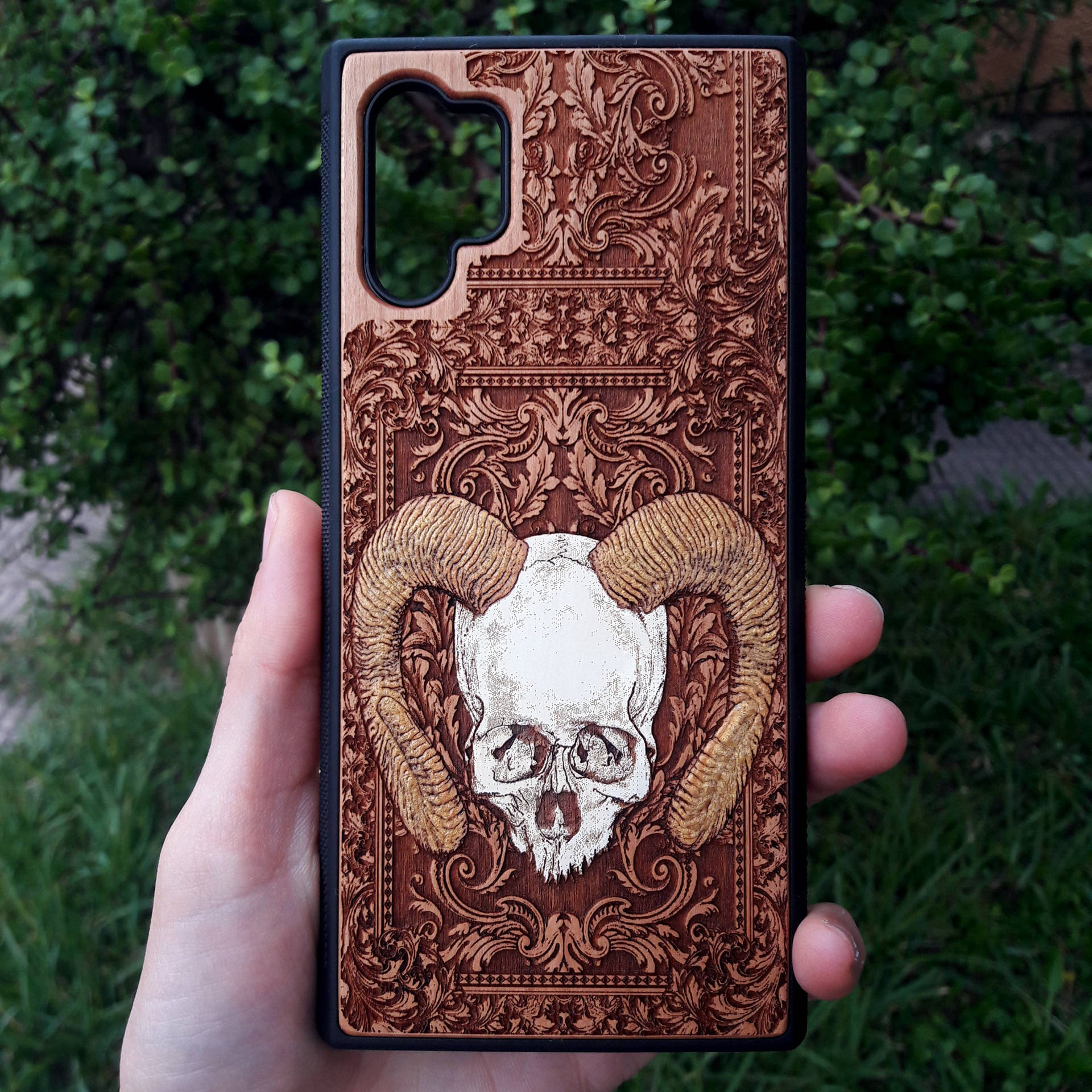 A Person Holding Up A Samsung Galaxy Note 10 Case With A Skull On It Wallpaper