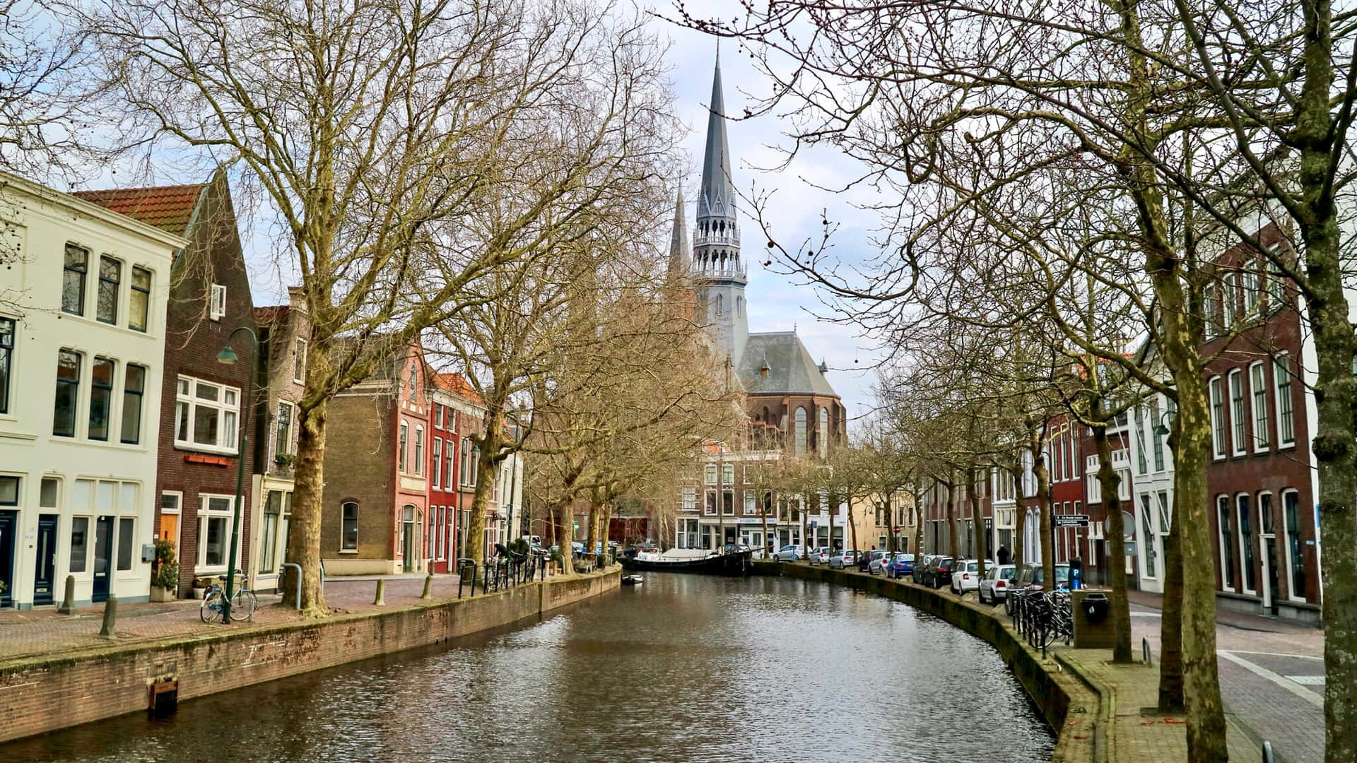 Download Gouda Historic Canal View Netherlands Wallpaper | Wallpapers.com