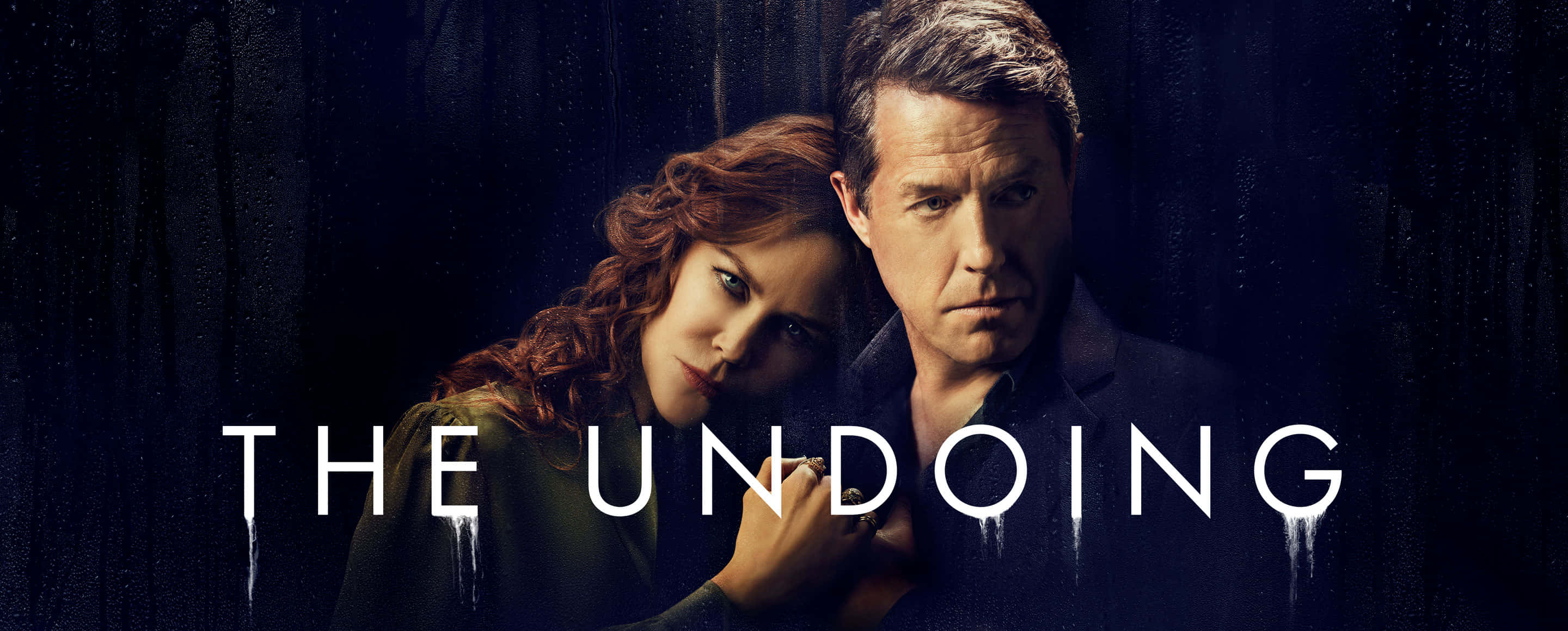 Grace Fraser And Jonathan Fraser Staring Intensely In The Undoing Series Wallpaper