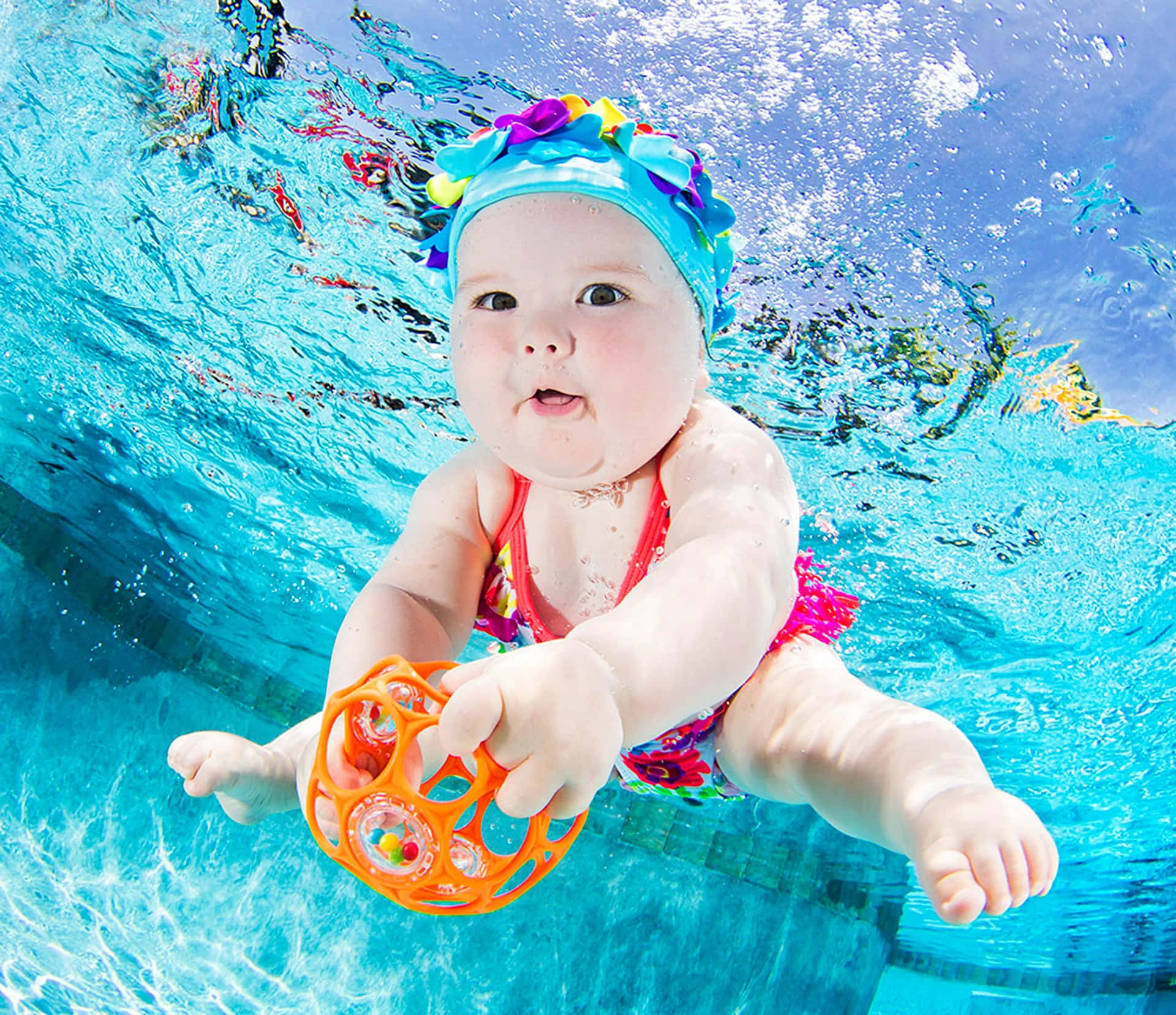 Download Graceful Underwater Swimmer | Wallpapers.com