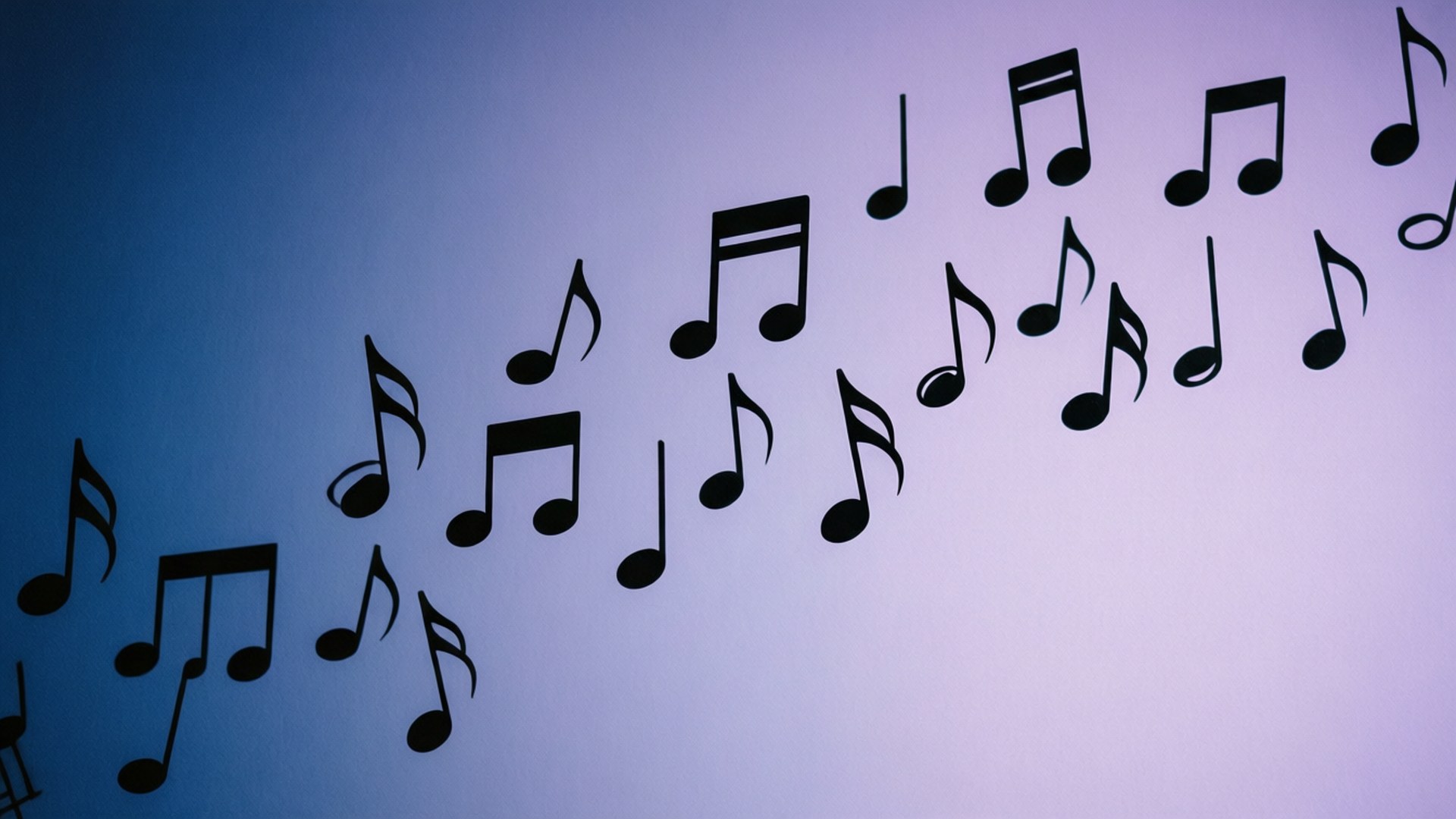 Minimalist wallpaper with scattered black music notes on a blue to purple gradient.