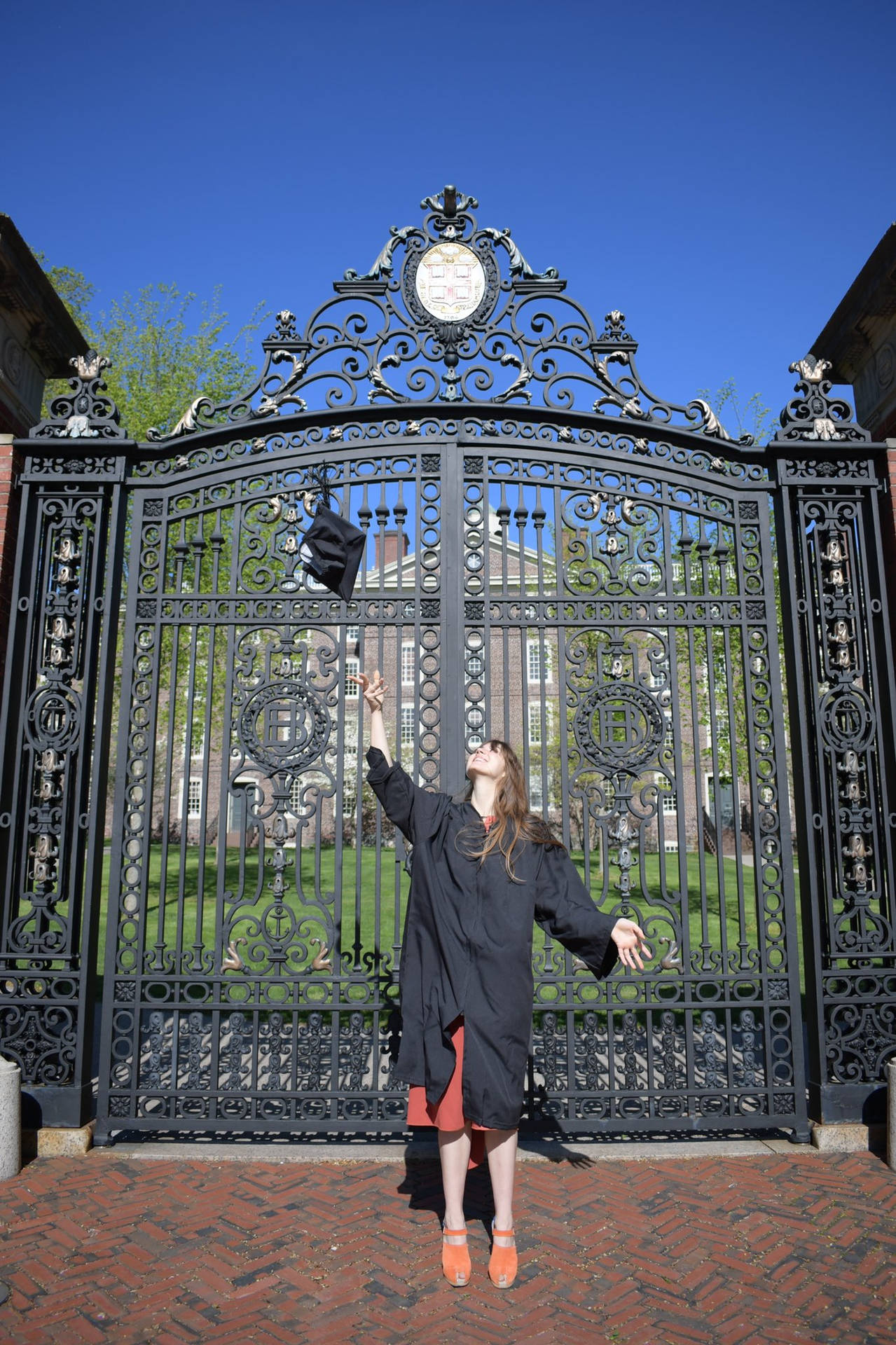 Graduate Posing At Brown University Gate Wallpaper