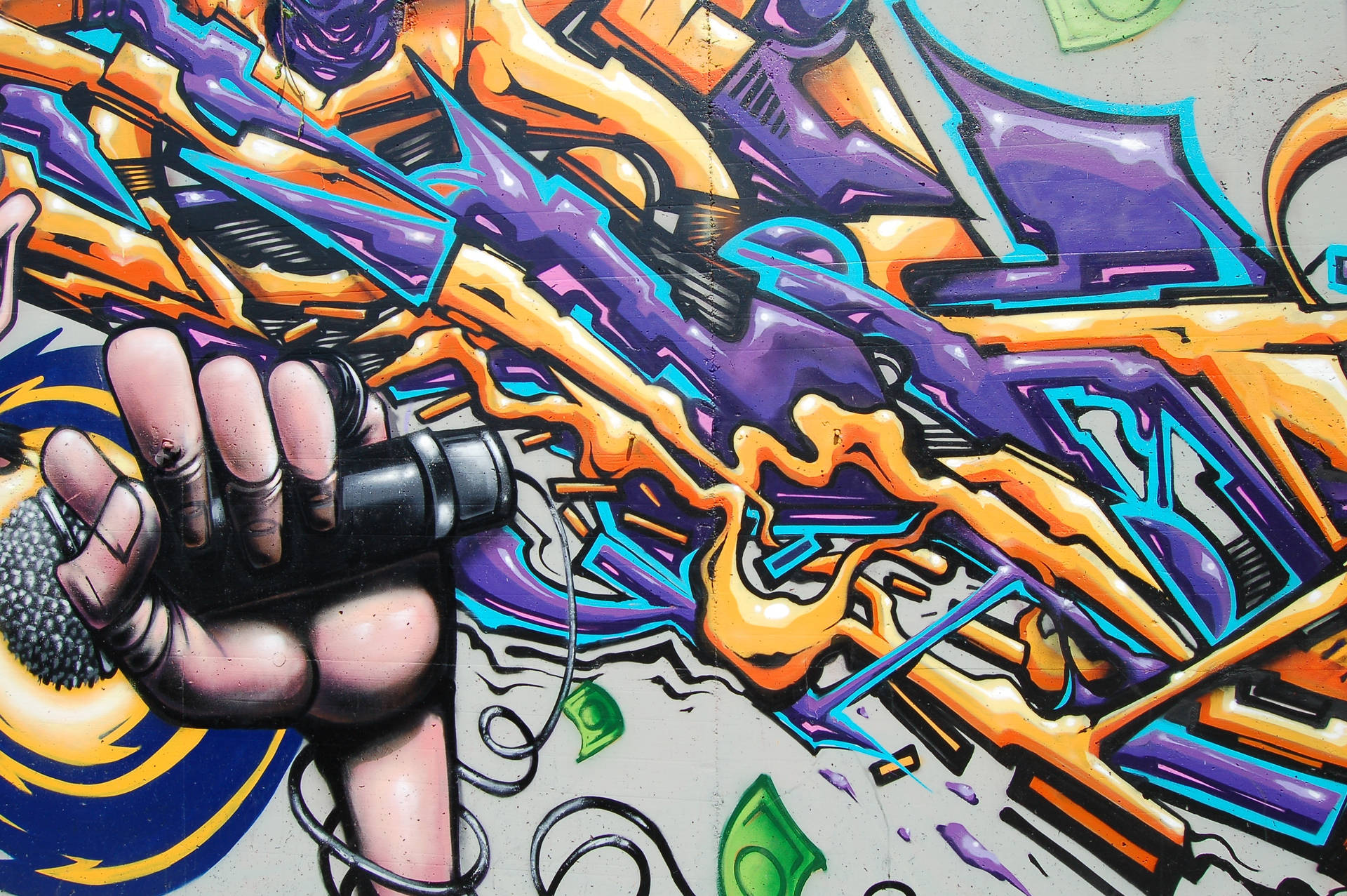 Adding the finishing touches to a vibrant music-inspired graffiti mural. Wallpaper