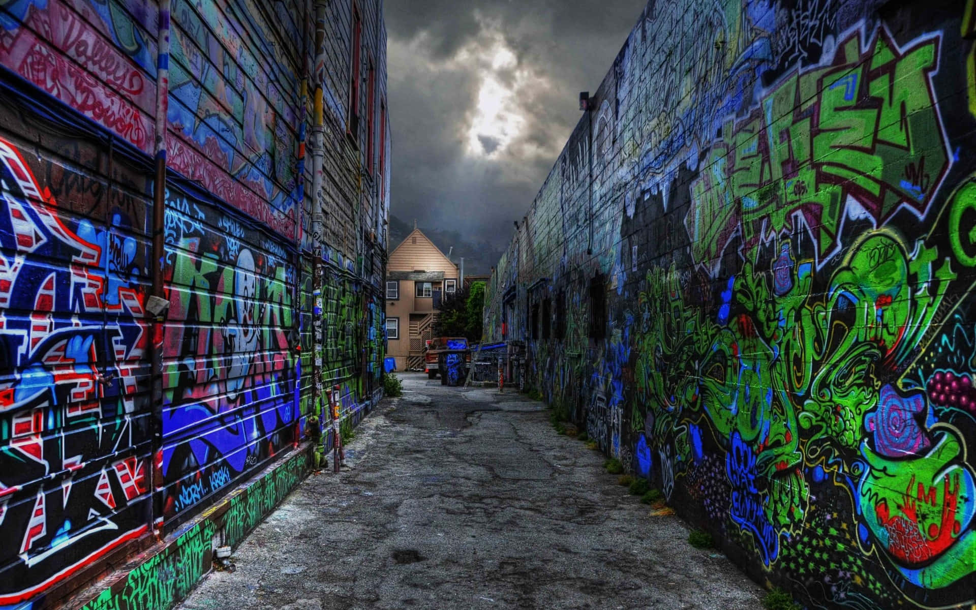 Graffiti Wall Art In A Narrow Alley Background