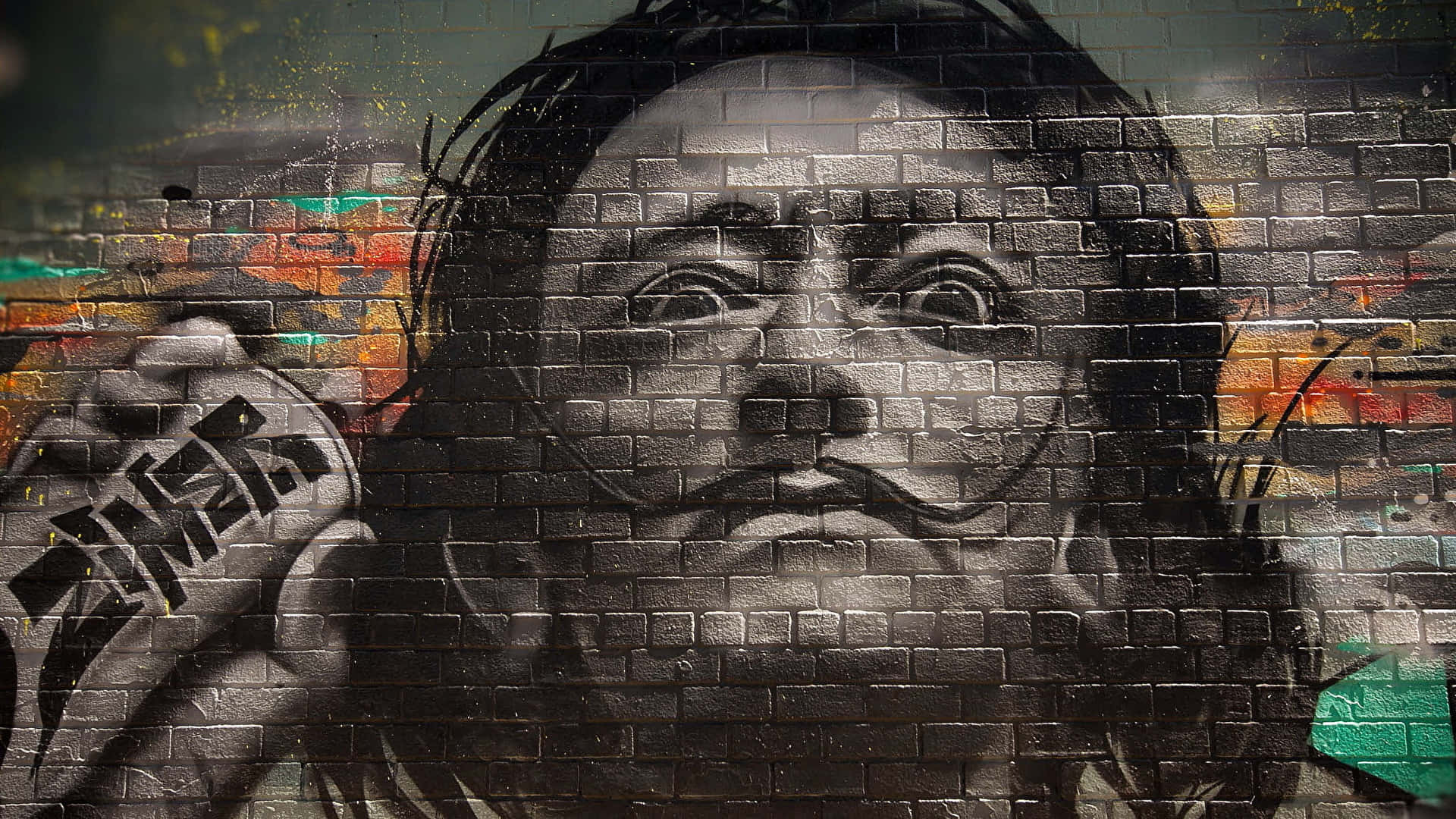 Graffiti Wall Art Of A Man With A Unique Mustache Wallpaper